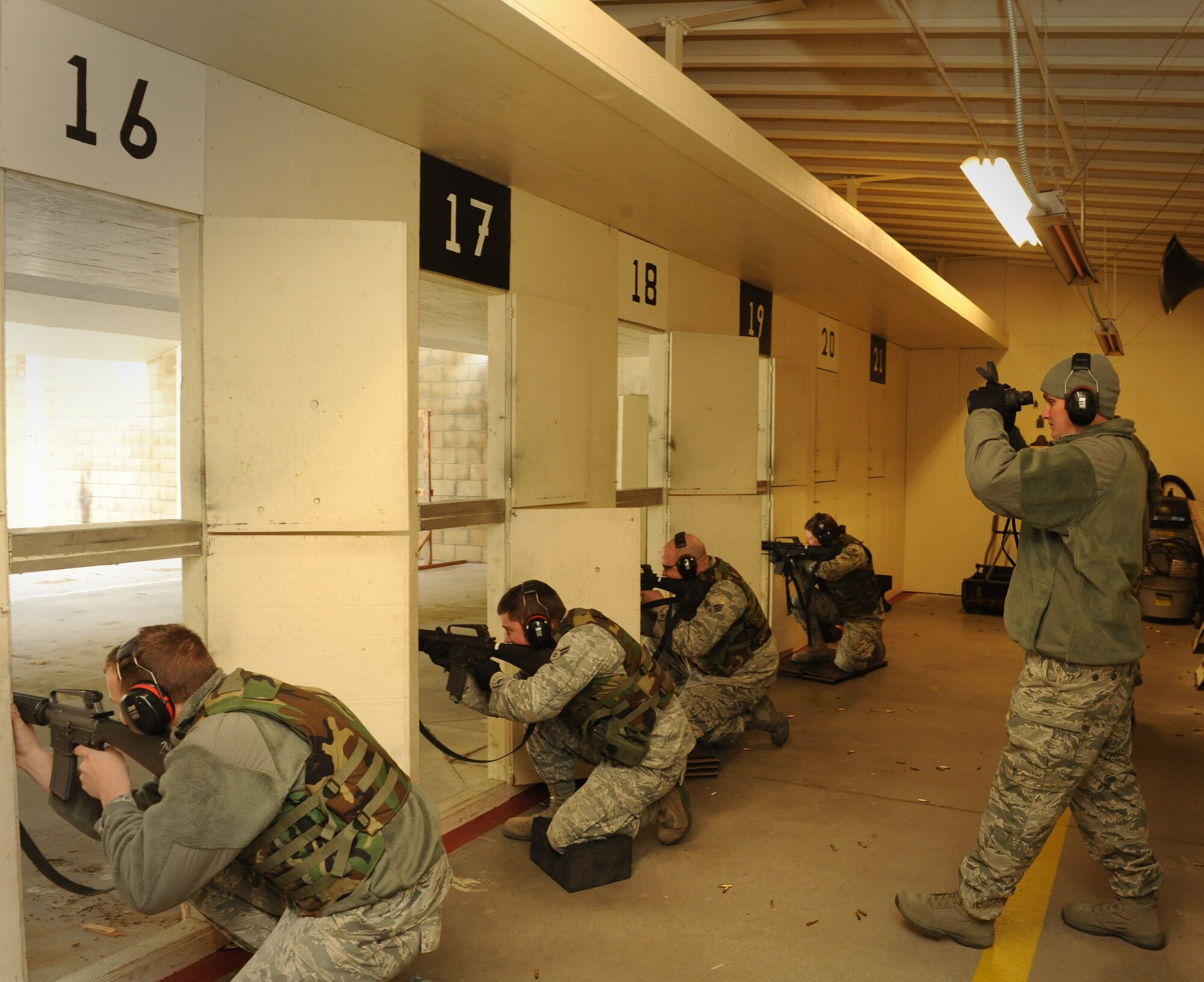 Staff Sgt. Darryl Worthey, 366th Security Forces Squadron combat arms instructor, uses binoculars to watch Air Force Rifle Qualification Course students shoot their targets on Dec. 14, 2011, at Mountain Home Air Force Base, Idaho. The AFRQC was recently revamped by Air Force leadership in response to criticisms the previous course was not sufficiently advanced. Students will now shoot 184 rounds at multiple targets, shoot from a standing, unsupported position on both “semi” and “burst” settings, and conduct quick-reaction drills. (U.S. Air Force photo/Senior Airman Alyssa C. Wallace)