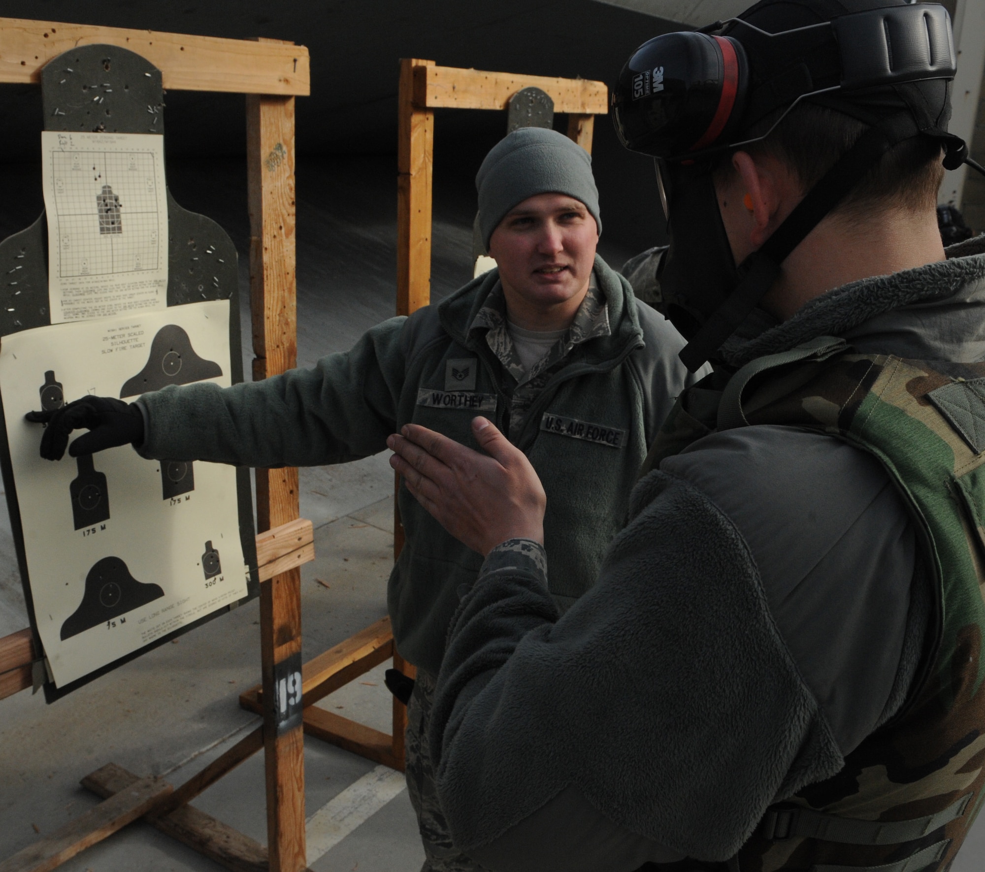 Staff Sgt. Darryl Worthey, 366th Security Forces Squadron combat arms instructor, gives an Air Force Rifle Qualification Course student pointers during weapons qualification Dec. 14, 2011, at Mountain Home Air Force Base, Idaho. The base’s AFRQC training was revamped to better prepare Airmen for combat downrange. The course was developed by Air Force leadership in response to criticisms the previous course was not sufficiently advanced. (U.S. Air Force photo/Senior Airman Alyssa C. Wallace)