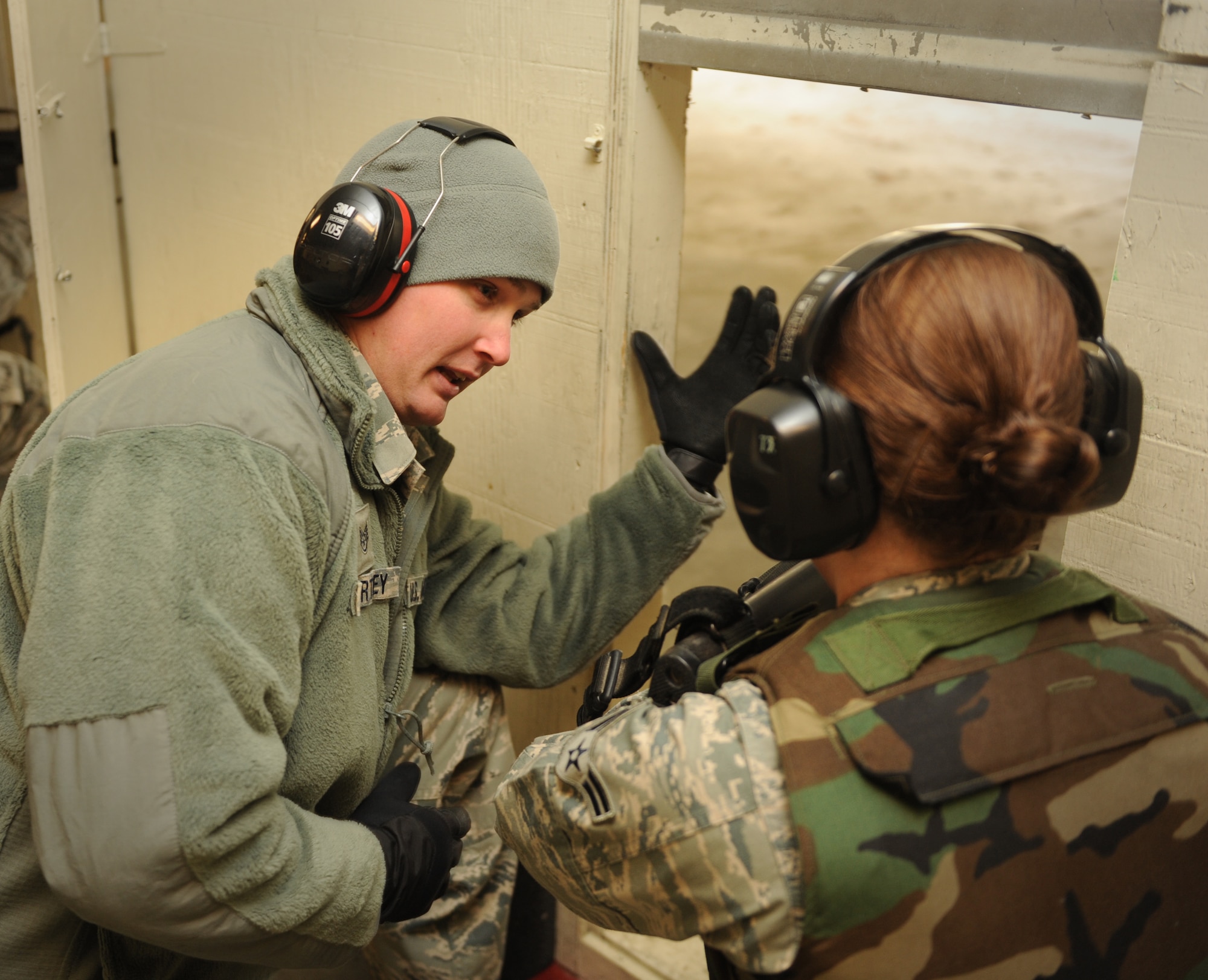 Staff Sgt. Darryl Worthey, 366th Security Forces Squadron combat arms instructor assistant, demonstrates the proper way to hold an M16 rifle to a student during the new Air Force Rifle Qualification Course Dec. 14, 2011, at Mountain Home Air Force Base, Idaho. During the new course, Airmen will fire close to 200 rounds at multiple targets, shoot from a standing, unsupported position on both “semi” and “burst” settings, and conduct quick-reaction drills. (U.S. Air Force photo/ Senior Airman Alyssa C. Wallace)