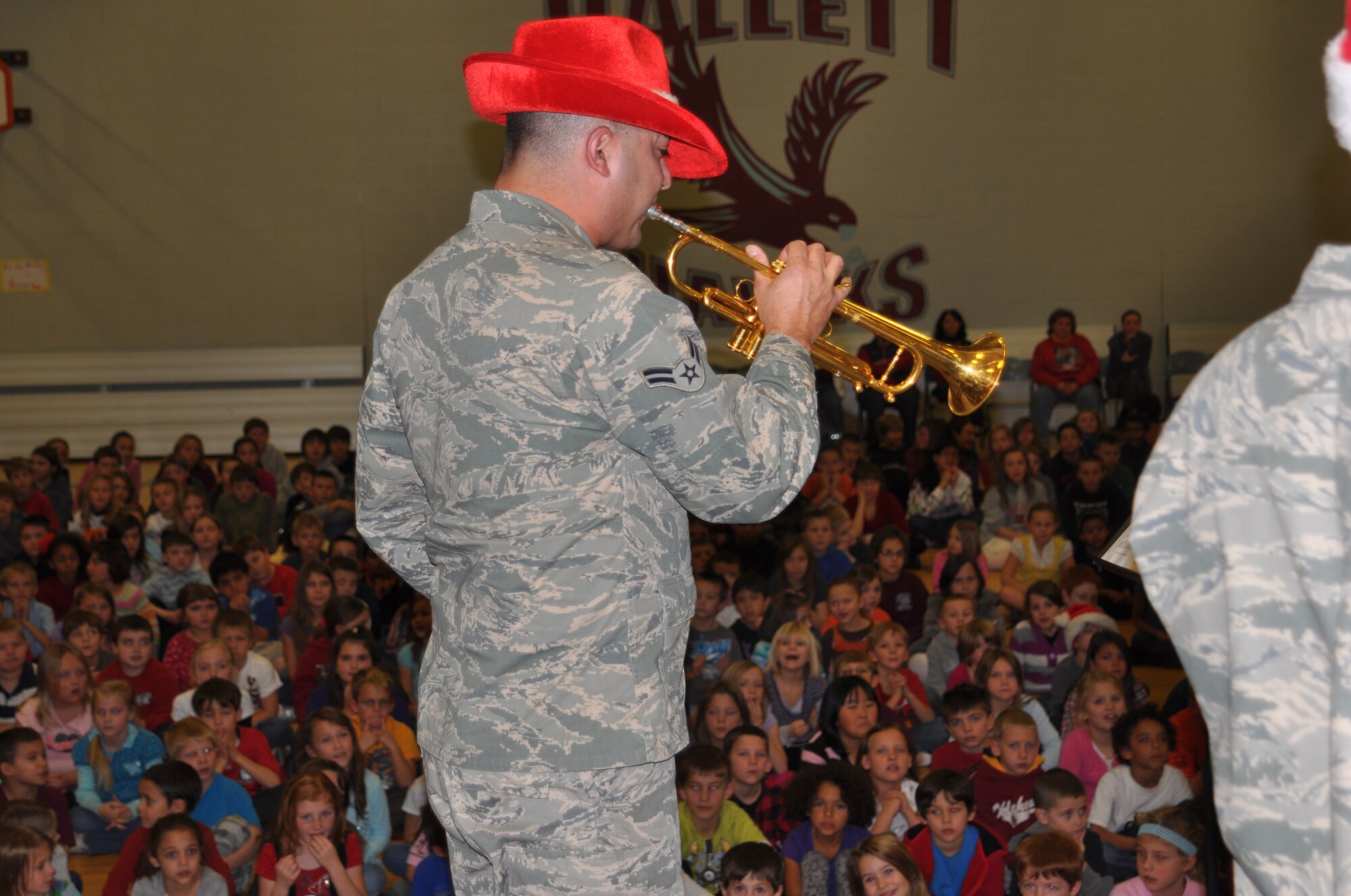 Hallett Elementary School, in Medical Lake received a free Christmas concert from the the Air Force Golden Band of the West Brass Ensemble. Senior Airman Matt Garza gave a demonstration of the trumpet.  (U.S. Air Force photo/Scott King)