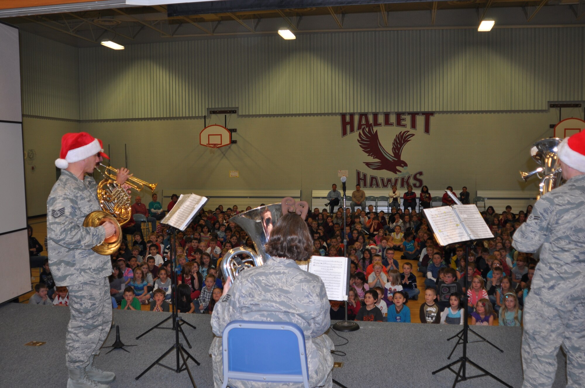 Hallett Elementary School, in Medical Lake received a free Christmas concert from the the Air Force Golden Band of the West Brass Ensemble. Staff Sgt. Robert Mayes, french horn and Staff Sgt. Corbett, Tuba perform “The Grinch.” (U.S. Air Force photo/Scott King)