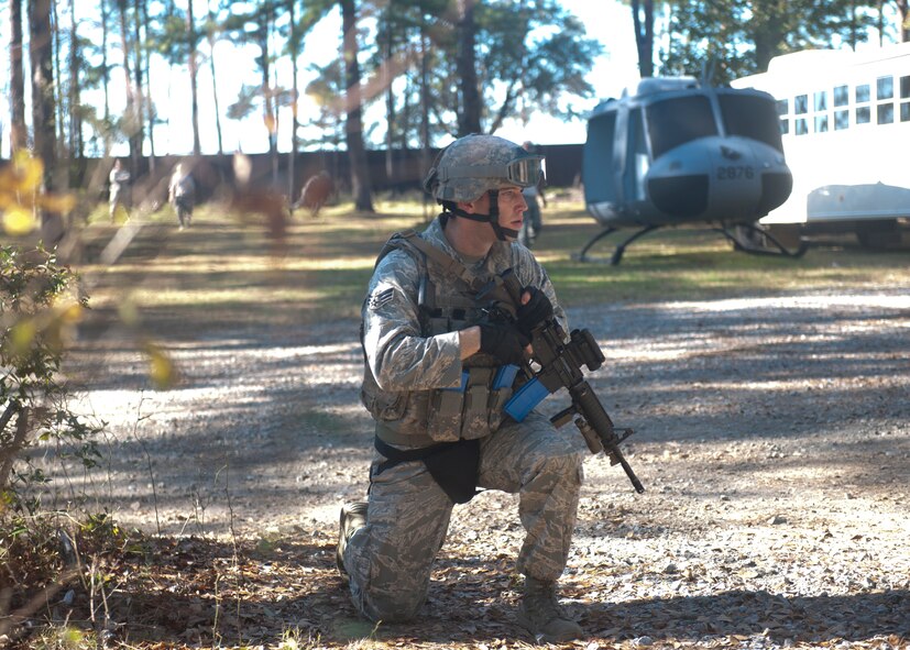 A student with the tactical leaders course stays vigilant during a scenario at the military operations in urban terrain village training at Moody Air Force Base, Ga., Dec. 14, 2011. The TLC students were in the midst of a 36-hour training mission and slept on cots before a second 36-hour mission shortly after. The exercises helped the Airmen become tactically efficient and able to step up to a leadership position when needed. (U.S. Air Force photo by Senior Airman Eileen Meier/Released)