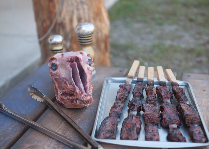 A tray of fake meat and head of an animal carcass are displayed in a reenacted Afghanistan village during tactical leaders course training at Moody Air Force Base, Ga., Dec. 14, 2011. Props like these and others were used to help give the TLC students an idea of an Afghan environment where villagers are unpredictable and easily disguised throughout the market stands. (U.S. Air Force photo by Senior Airman Eileen Meier/Released)