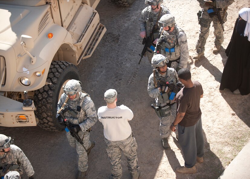 Members of different squadrons at Moody Air Force Base, Ga., participate in a tactical leaders course at the military operations in urban terrain village, Dec. 14, 2011. Training leaders set up scenarios that replicate what a real Afghanistan village is like to teach the students how to be tactically efficient in unpredictable situations. To simulate the additive stress during deployed environments, the TLC Airmen also worked two 36-hour missions, slept on cots and had little time to themselves. (U.S. Air Force photo by Senior Airman Eileen Meier/Released)
