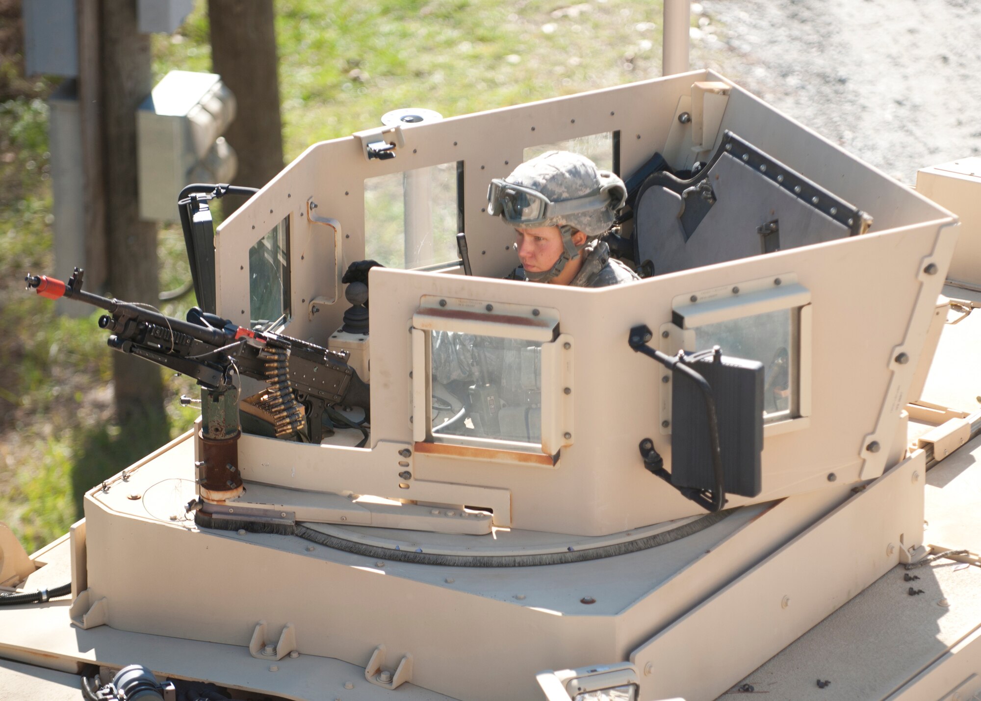 U.S. Air Force Senior Airman Erin Himmel, 820th Combat Operations Squadron, operates an M2.50- caliber heavy machine gun on a mine-resistant ambush-protected vehicle during a tactical leaders course at Moody Air Force base, Ga., Dec. 14, 2011. The TLC students trained at the military operations in urban terrain village where they participated in scenarios that stage real life situations. The purpose of the exercise was to teach the Airmen how to remain tactically efficient and handle unpredictable people. (U.S. Air Force photo by Senior Airman Eileen Meier/Released)