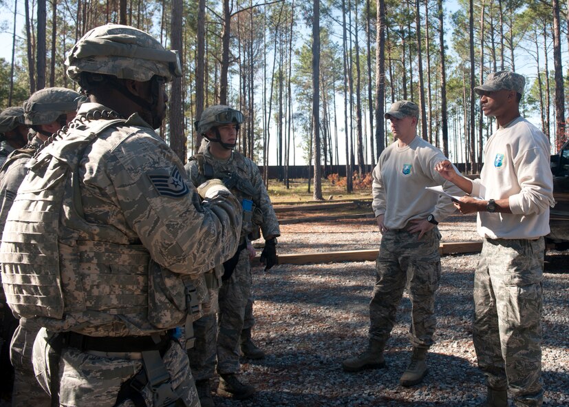 Tactical leaders course instructors brief students prior to entering the military operations in urban terrain village, where they will interact with role players acting as unpredictable southwest asian civilians at Moody Air Force Base, Ga., Dec. 14, 2011. The students were involved in scenarios where enemies may or may not engage, so the Airmen must learn to be tactically efficient and learn how to react to incidents in deployed environments. (U.S. Air Force photo by Senior Airman Eileen Meier/Released)