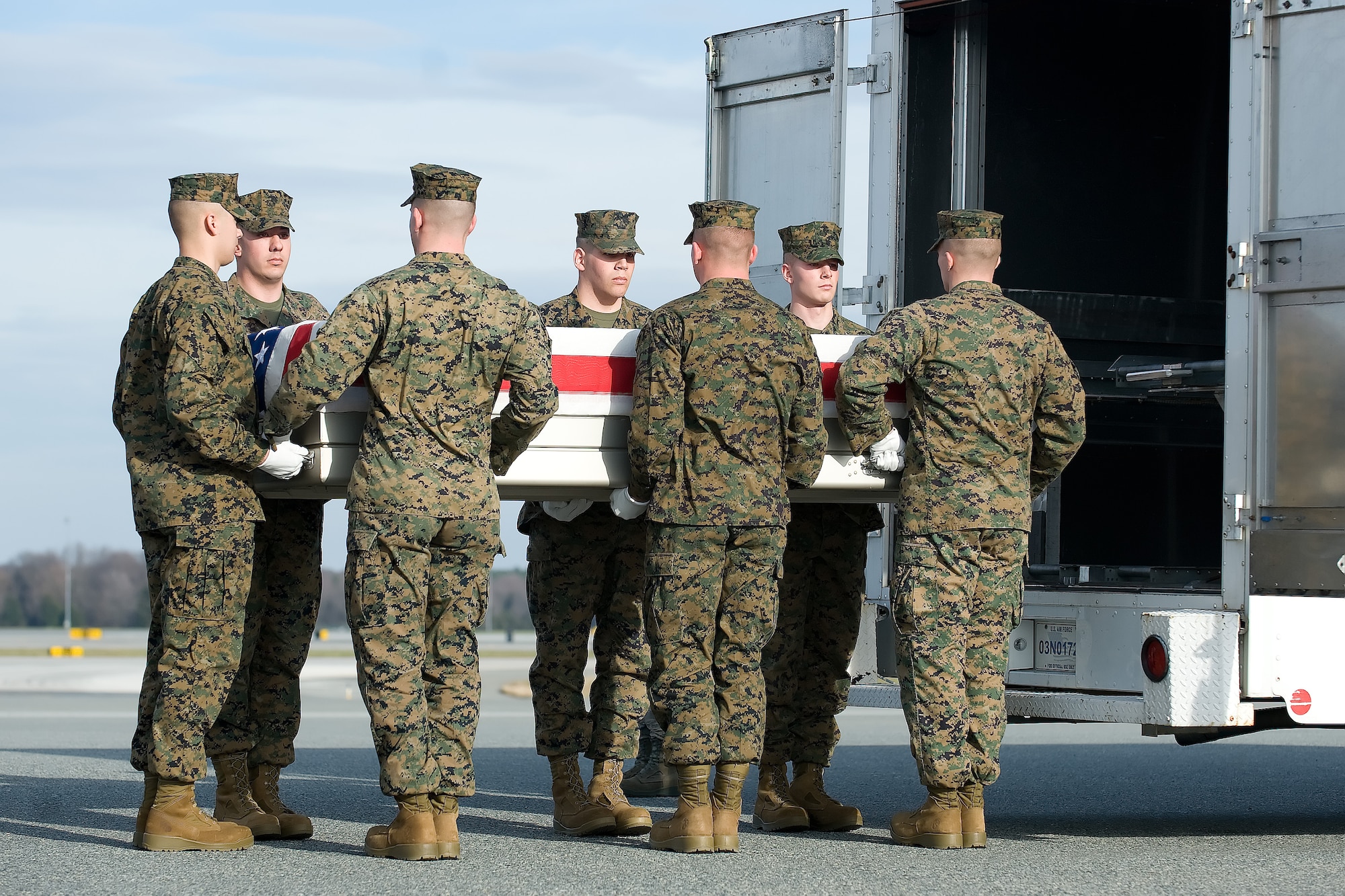 A U.S. Marine Corps carry team transfers the remains of Marine Lance Cpl. Christopher P. J. Levy of Ramseur, N.C., at Dover Air Force Base, Del., Dec. 15, 2011. Levy was assigned to the 1st Battalion, 6th Marine Regiment, 2nd Marine Division, II Marine Expeditionary Force, Camp Lejeune, N.C. (U.S. Air Force photo/Adrian R. Rowan)