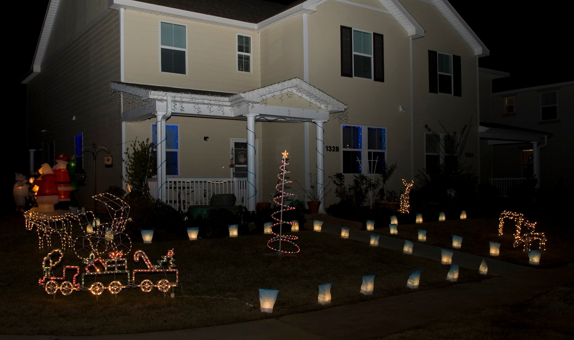 Barksdale homes shine brightly with Christmas decorations on Barksdale Air Force Base, La., Dec. 13. Every year, members of the Barksdale Chief's Group drive around base housing and select the best decorated homes. More than 100 homes were looked at, with two winners selected from the East Side and two from main base. (U.S. Air Force photo/Airman 1st Class Benjamin Gonsier)(RELEASED)