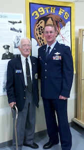 Retired Col. Frank Royal and Lt. Col. Roger Suro, 39th Flying Training Squadron commander, pose for a photo before the squadron's 70th anniversary banquet in Bellingham, Wash., Oct. 15, 2011.  Col. Royal, then a second lieutenant, was one of the commanders for the squadron and led the unit to the South Pacific where they would go on to become one of the most-decorated squadrons of World War II.  (Courtesy Photo)