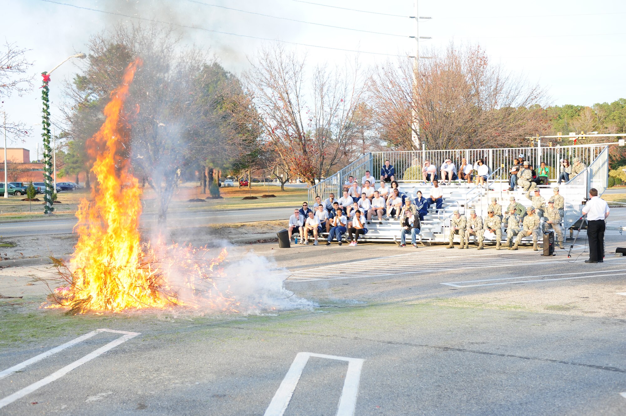 In less than a minute, a live Christmas tree is engulfed in flames in the Xchange parking lot on Seymour Johnson Air Force Base, N.C., Dec. 14, 2011. The 4th Civil Engineer Squadron fire department urges Airmen and their families to properly care for their live trees to prevent fires. (U.S. Air Force photo by Senior Airman Rae Perry)
