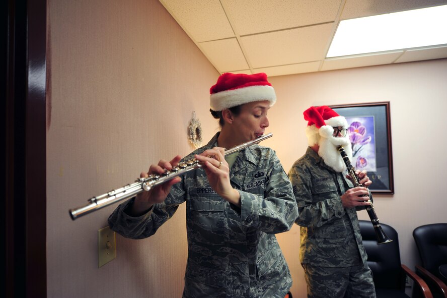 Tech. Sgt. Anne Epperly and Staff Sgt. Jeffrey Boehmer perform for the staff and visitors of the Airman and Family Readiness Center on Seymour Johnson Air Force Base, N.C., Dec. 14, 2011. The performers came from Joint Base Langley-Eustis to entertain Airmen and help get them in the holiday spirit. Epperly, flutist, is a native of Martinsville, Va., and Boehmer, clarinetist, is from Frederick, Md. Both are members of the Joint Base Langley-Eustis Langley Winds. (U.S. Air Force photo by Senior Airman Rae Perry)