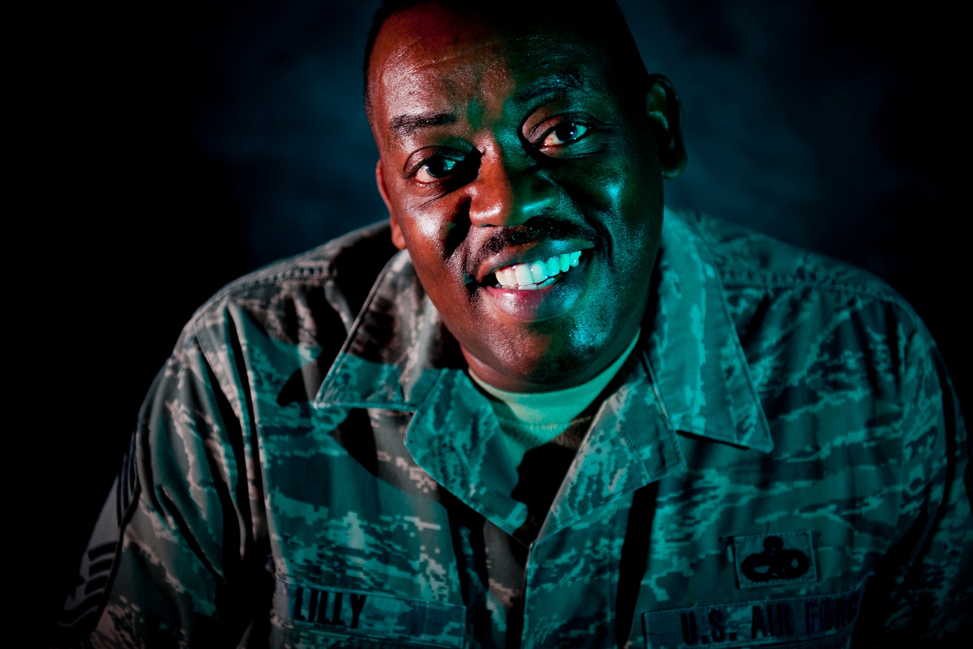 U.S. Air Force Chief Master Sgt. Kenneth Lilly, 23rd Wing weapons manager, shares a smile while conducting an interview Dec. 14, 2011, at Moody Air Force Base, Ga. Lilly is scheduled to retire from active duty service March 1 of next year, with a ceremony scheduled for Dec. 19, 2011. Throughout his career as a leader, he has been straightforward and honest with his Airmen to ensure they got what they needed to hear rather than what they wanted to hear. Lilly said the thing he’ll miss most about the Air Force is its camaraderie. (U.S. Air Force photo by Staff Sgt. Jamal D. Sutter/Released)
