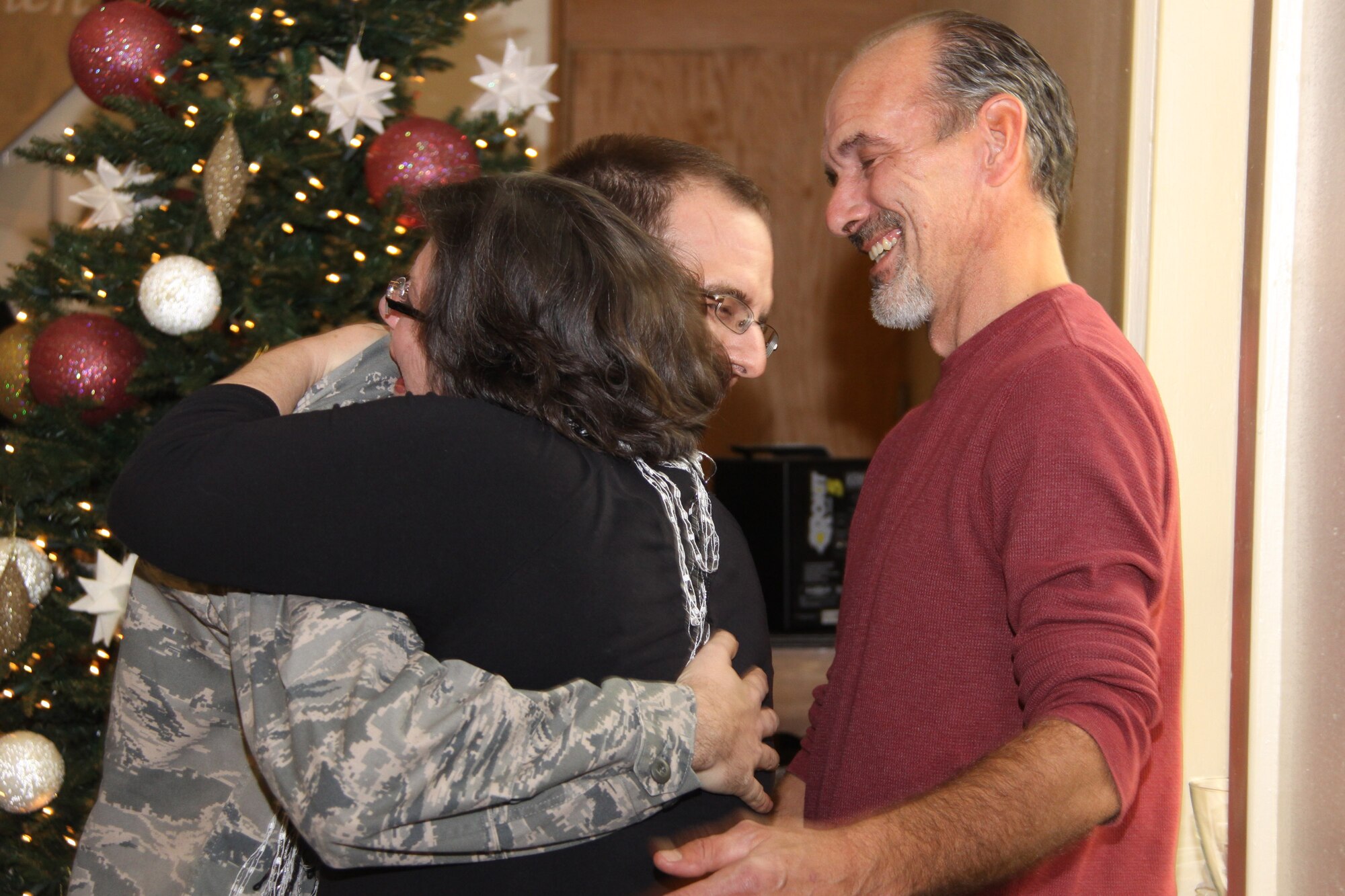 Carol and David Fodi, welcome their son, Capt. Thomas Fodi, 911th Airlift Wing chaplain, home from his deployment to Iraq, Dec. 4. Capt. Fodi surprised family and church members by unexpectedly arriving home four weeks early during the Emmanuel Christian Church’s Sunday service. (U.S. Air Force photo by Senior Airman Jonathan Hehnly/released)