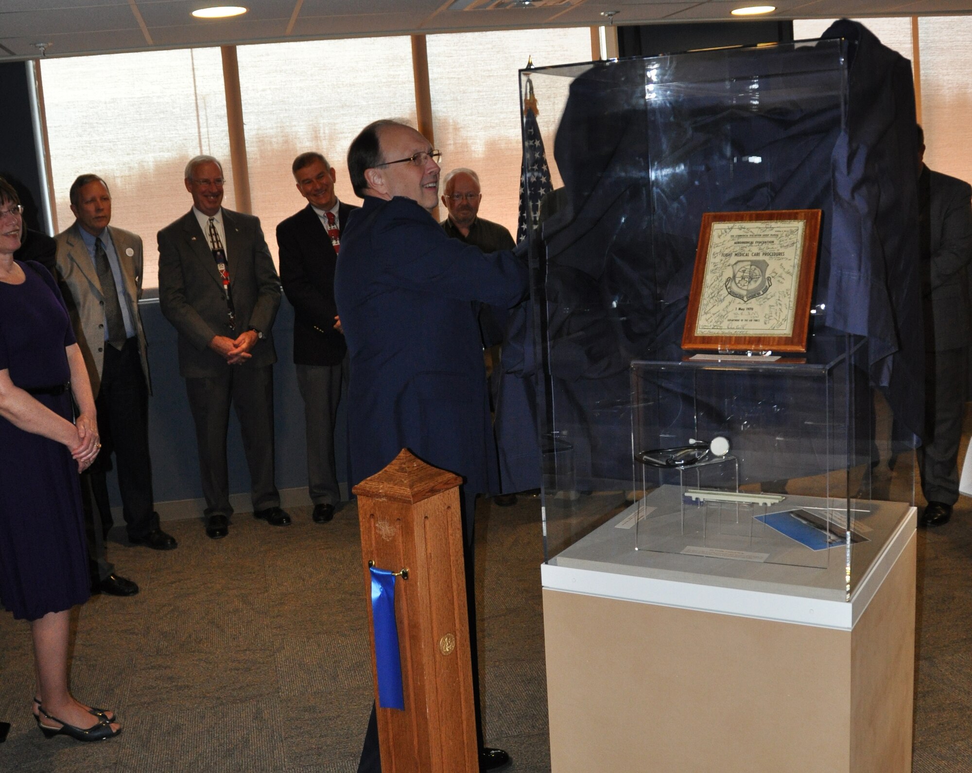 Lt. Gen. Charles E. Stenner, Jr., commander Air Force Reserve Command, unveils the first of several exhibits during the inauguration of the Air Force Reserve Command Heritage Hall in the command headquarters building on Robins Air Force Base, Ga., Dec. 15.  (U.S. Air Force photo/Philip Rhodes)