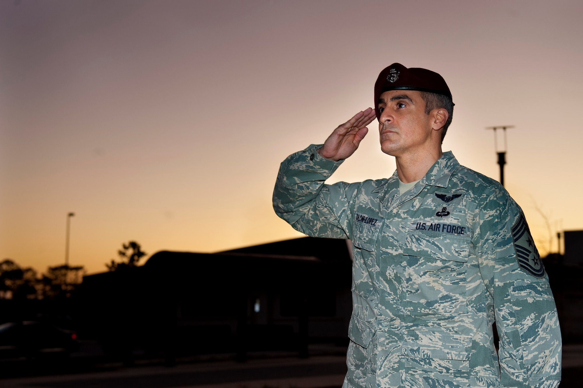 U.S. Air Force Chief Master Sgt. Ramon Colon-Lopez, command chief of the 1st Special Operations Wing, renders a salute during retreat at wing headquarters at Hurlburt Field, Fla., Dec. 14, 2011. Colon-Lopez assumed leadership as command chief from retired Chief Master Sgt. Dexter Mitchell Nov. 30, 2011. (U.S. Air Force photo/Airman 1st Class Christopher Williams)(Released)