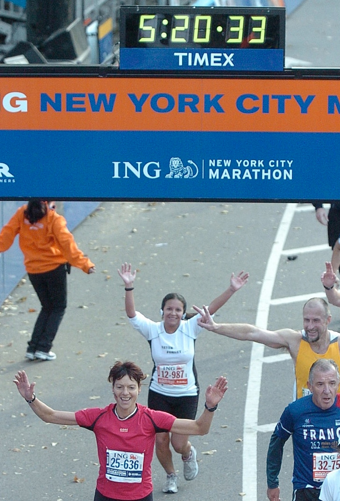 U.S. Air Force Staff Sgt. Megan Cotter, 355th Medical Group noncommissioned officer in charge of immunizations, throws up hands up as she crosses the finish line of the New York City marathon Nov. 6. When Sergeant Cotter expressed interest to her father while she was deployed, he said he would try and get her into the marathon. He wrote a letter to the NYC marathon offices and within weeks Cotter had a congratulatory letter and entry number that she could wear as a participant. (Courtesy photo)