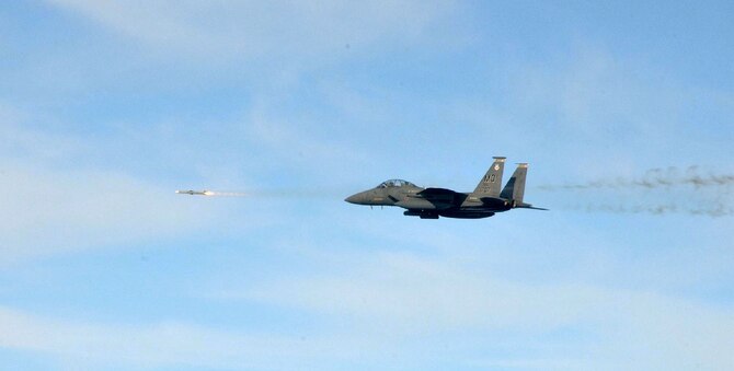 An F-15E Strike Eagle from Mountain Home Air Force Base, Idaho, fires a missile while participating in a training exercise during Combat Archer at Tyndall Air Force Base, Fla., Dec. 6, 2011. Throughout the exercise, the 389th Fighter Squadron fired 23 missiles with zero range-safety violations and the 389th Aircraft Maintenance Squadron was evaluated 218 separate times and also had zero discrepancies. (Courtesy photo) 