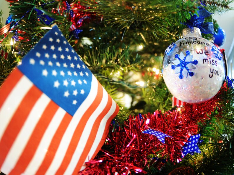 Ornaments hang on the Christmas tree at the Carolina Skies Club at Shaw Air Force Base, S.C., Dec. 15, 2011. The tree was decorated by families of deployed Airmen and Soldiers in honor of their loved ones who will not be here this holiday season. (U.S. Air Force photo by Airman 1st Class Tabatha Duarte/Released)