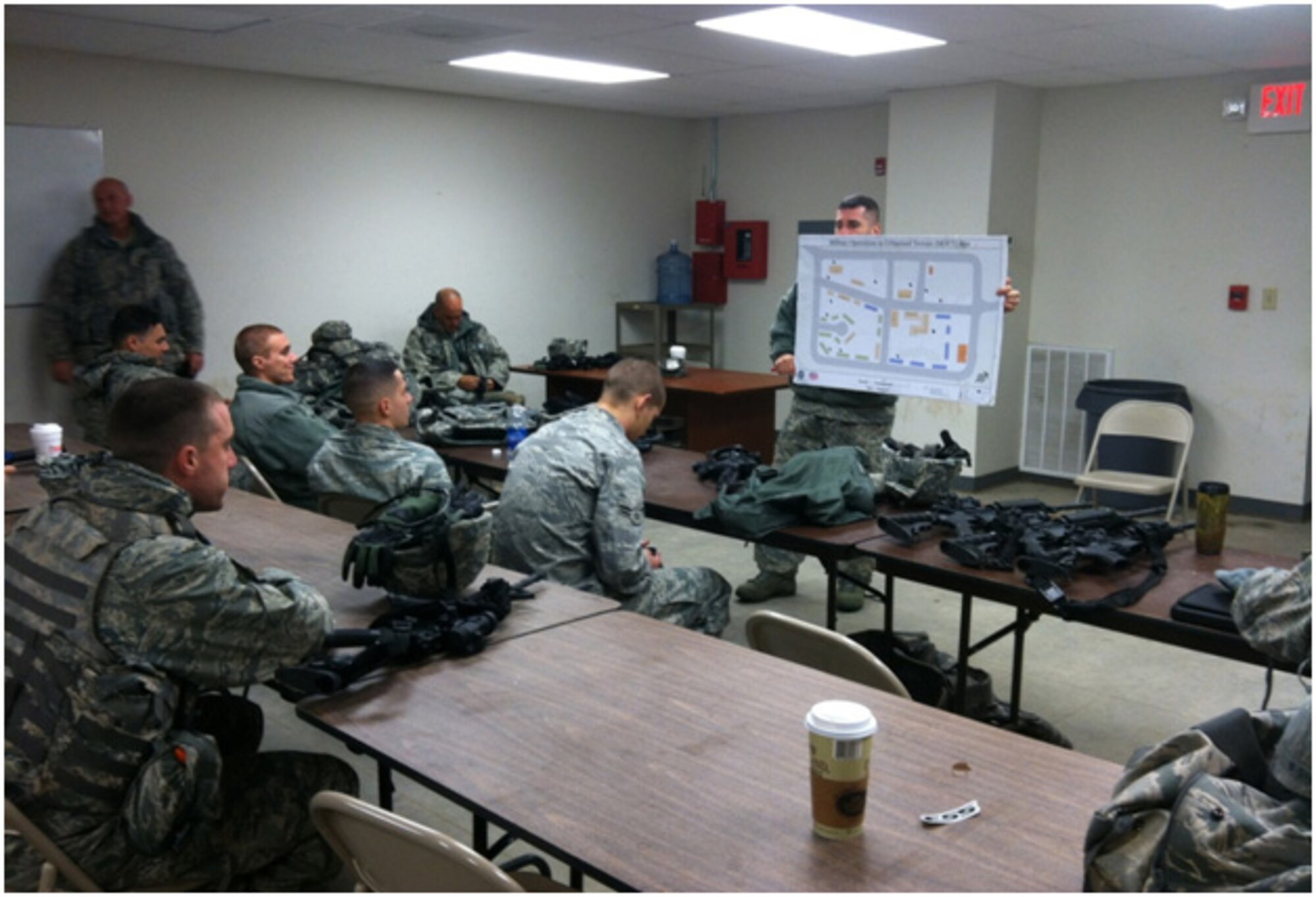 Staff Sgt. Adam Sassone familiarizes Defenders with key areas of the MOUT village and concept of operations for the Traffic Control Point exercise. (National Guard photo by Staff. Sgt. Johnny Grullon/Released)