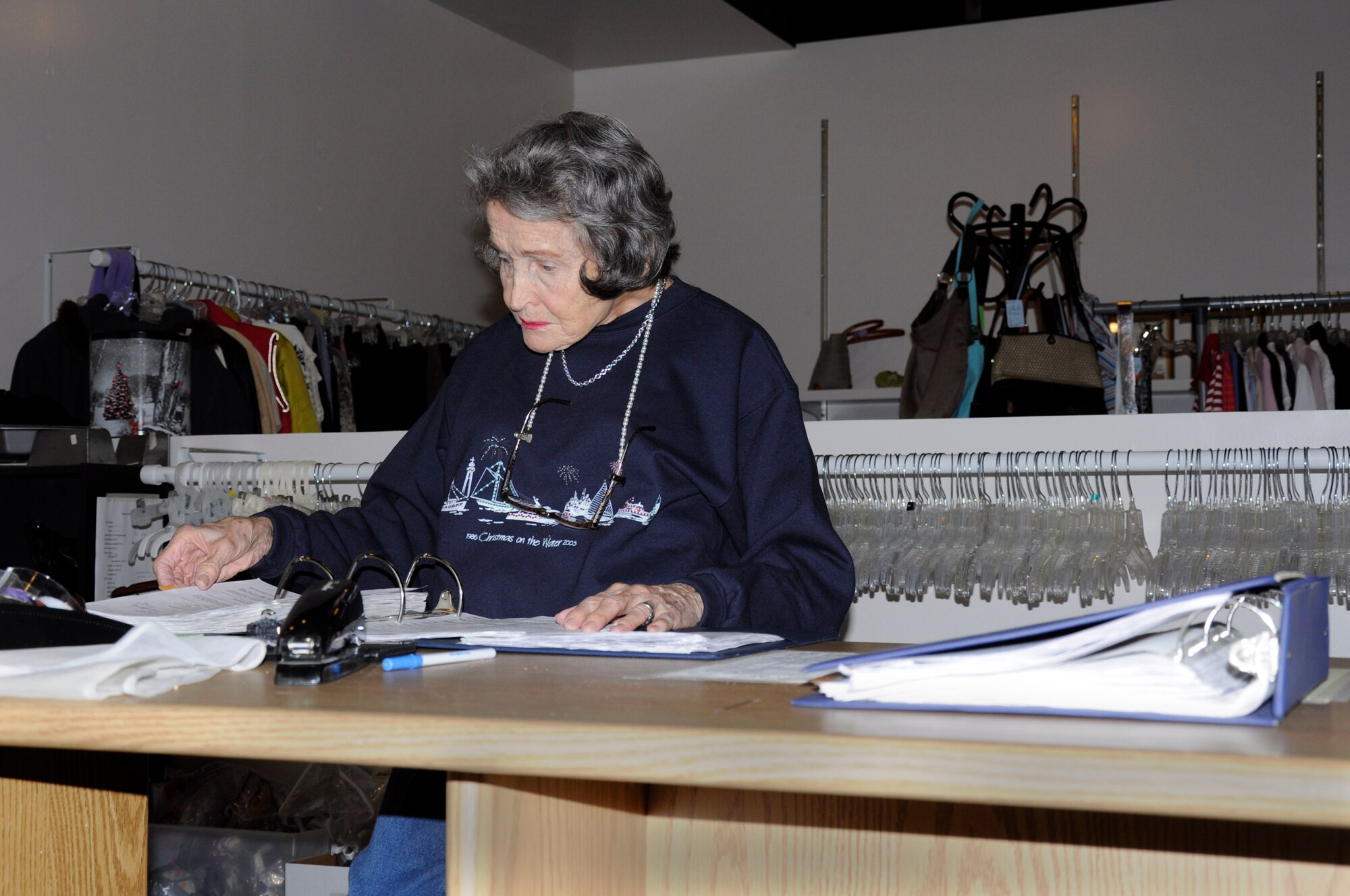 Jean Elton, a volunteer at the Hurlburt Field thrift shop helps with the daily operations from pricing and arranging merchandise to paper filing. The Hurlburt Field thrift shop is run primarily by volunteers. All proceeds from the shop go to benefit the military and local community. (U.S. Air Force photo/Raquel Sanchez) (Released)