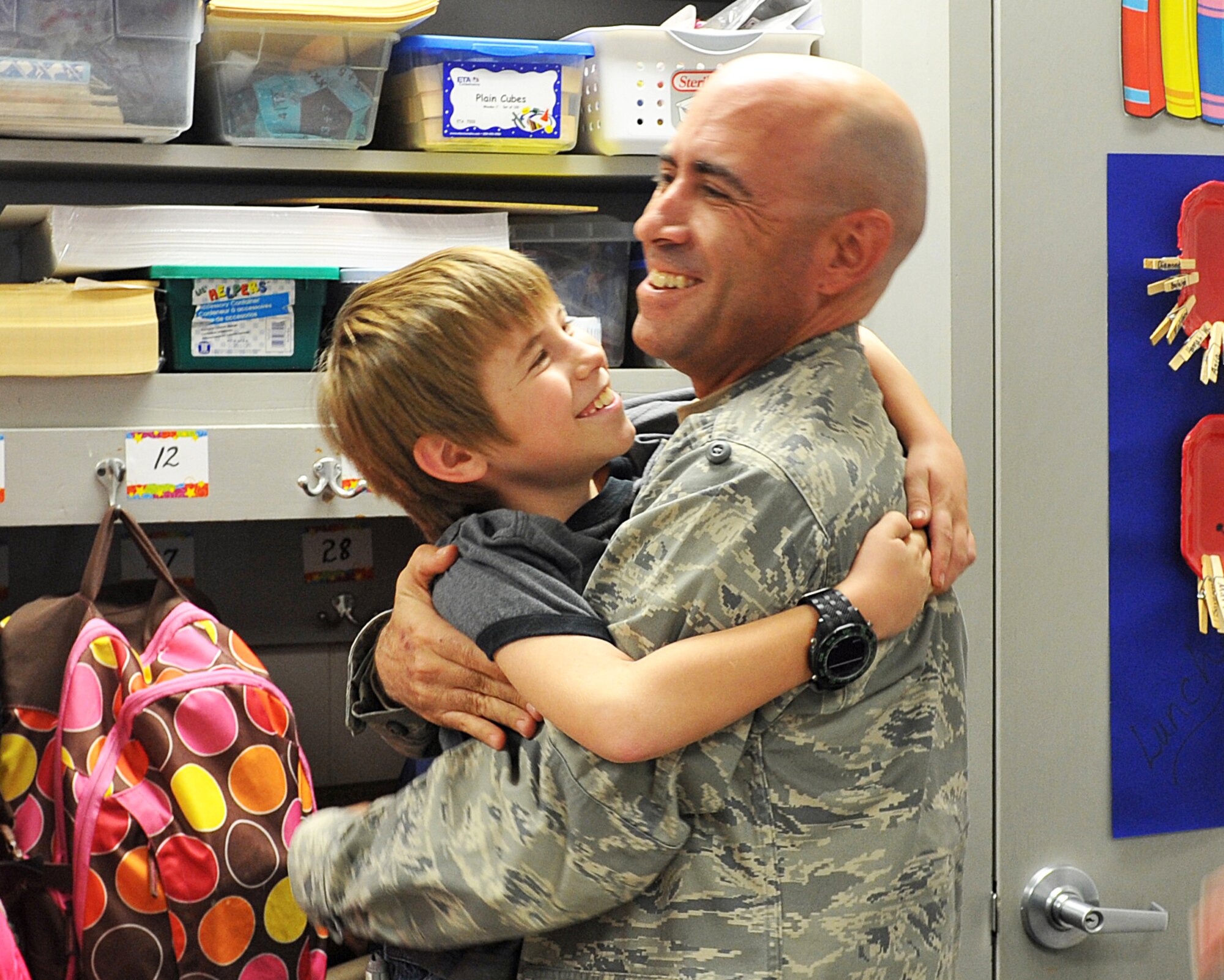 Capt. Nathan List hugs his 9-year-old son James Dec. 9. Capt. List returned home early from Iraq to surprise his son James,  at Shirley Hills Elementary School, and Chloe at Warner Robins Middle School. List, who has been deployed since before July 4, was not expected home until after Christmas.  With President Obama's acceleration of the drawdown of troops, the Air Force Reserve Command captain made it home three weeks earlier than originally planned.  He and his wife, Lisa, first surprised Chloe at Warner Robins Middle, then went to Shirley Hills Elementary to surprise James. U.S. Air Force photo by Tommie Horton