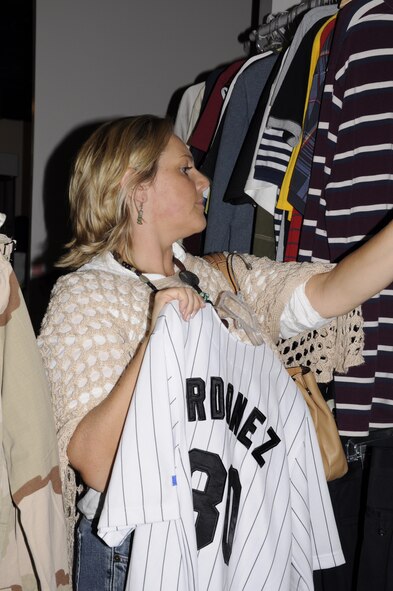 Zofia Vanselow, a shopper at the Hurlburt Field thrift shop, browses through the clothing section. Shoppers can find a variety of unique items at the shop at discounted prices. (U.S. Air Force photo/Raquel Sanchez) (Released) (U.S. Air Force photo/Raquel Sanchez) (Released) 