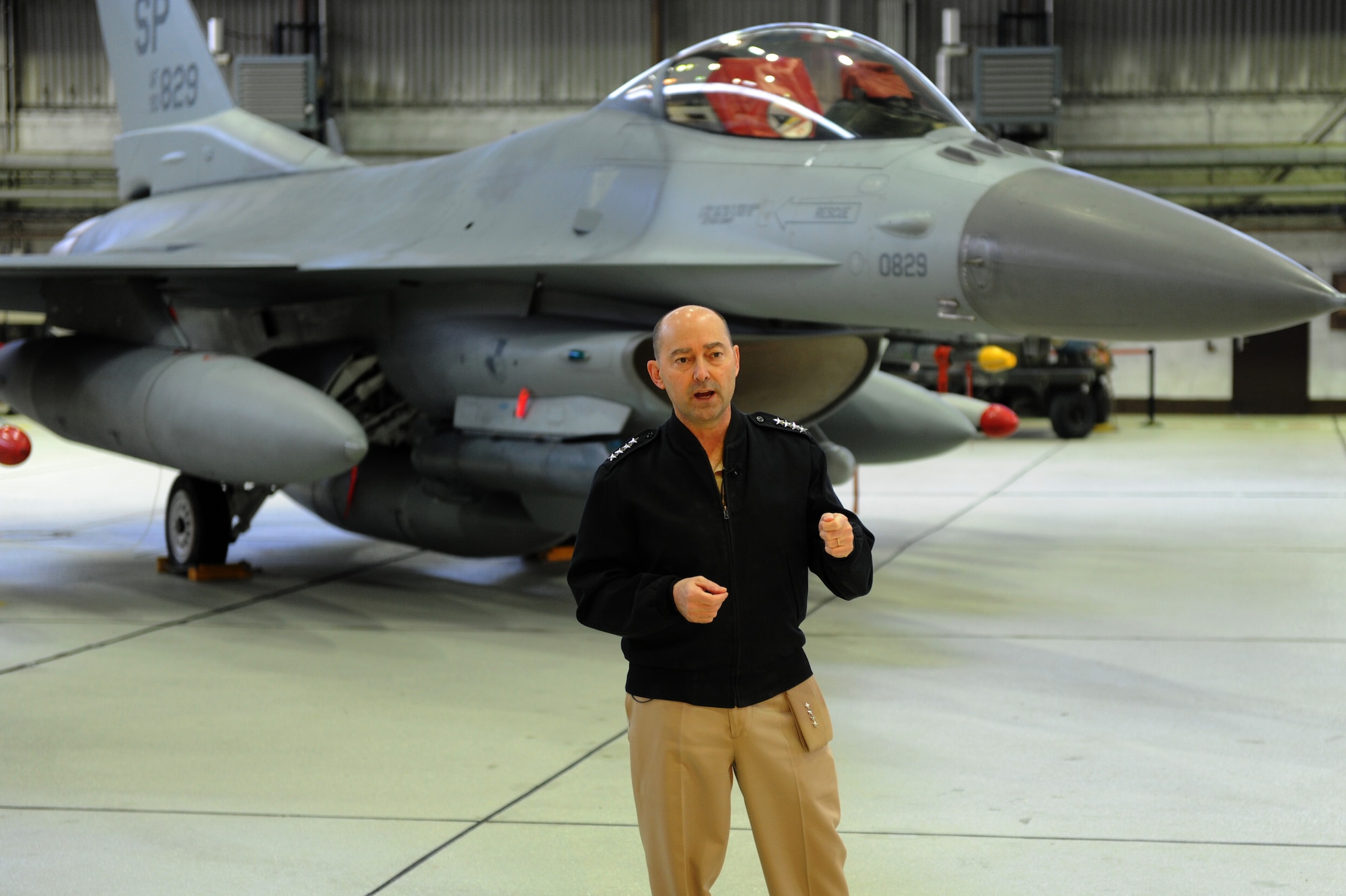 SPANGDAHLEM AIR BASE, Germany -- U.S. Navy Adm. Jim Stavridis, U.S. European Command commander and NATO Supreme Allied Commander Europe, filmed an American Forces Network commercial in Hangar 1 here Dec. 14. During his familiarization tour, Stavridis saw the unique capabilities the 52nd Fighter Wing provides to the European theater of operations and learned about some of the wing’s accomplishments this year. (U.S. Air Force photo/Airman 1st Class Matthew B. Fredericks)