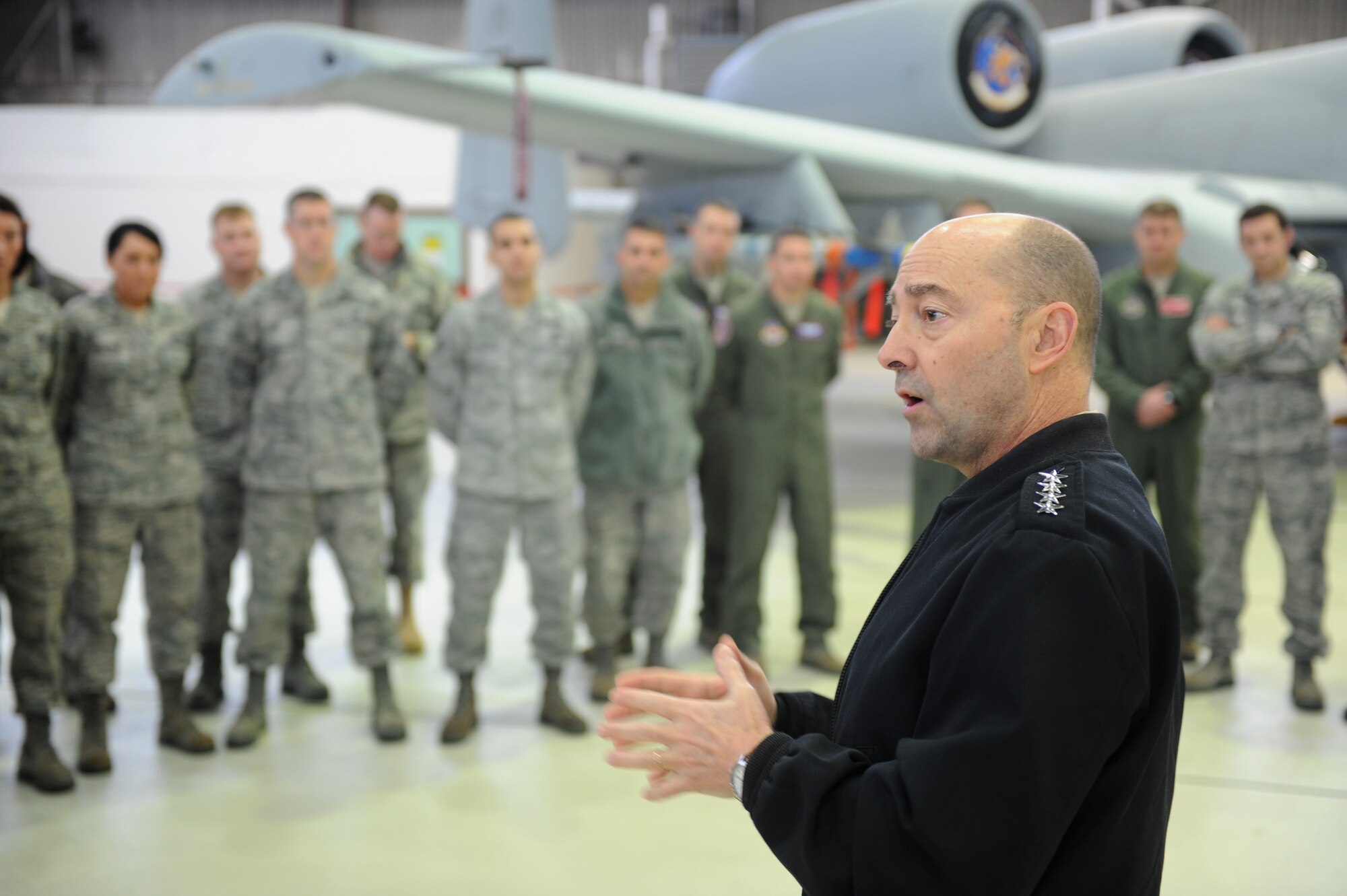 SPANGDAHLEM AIR BASE, Germany -- U.S. Navy Adm. Jim Stavridis, U.S. European Command commander and NATO Supreme Allied Commander Europe, visited with Airmen in Hangar 1 here Dec. 14 as part of a familiarization tour. He thanked the Airmen for their hard work to secure enduring stability in Europe and Eurasia. During the visit, Stavridis saw the unique capabilities the 52nd Fighter Wing provides to the European theater of operations and learned about some of the wing’s accomplishments this year. (U.S. Air Force photo/Airman 1st Class Matthew B. Fredericks)