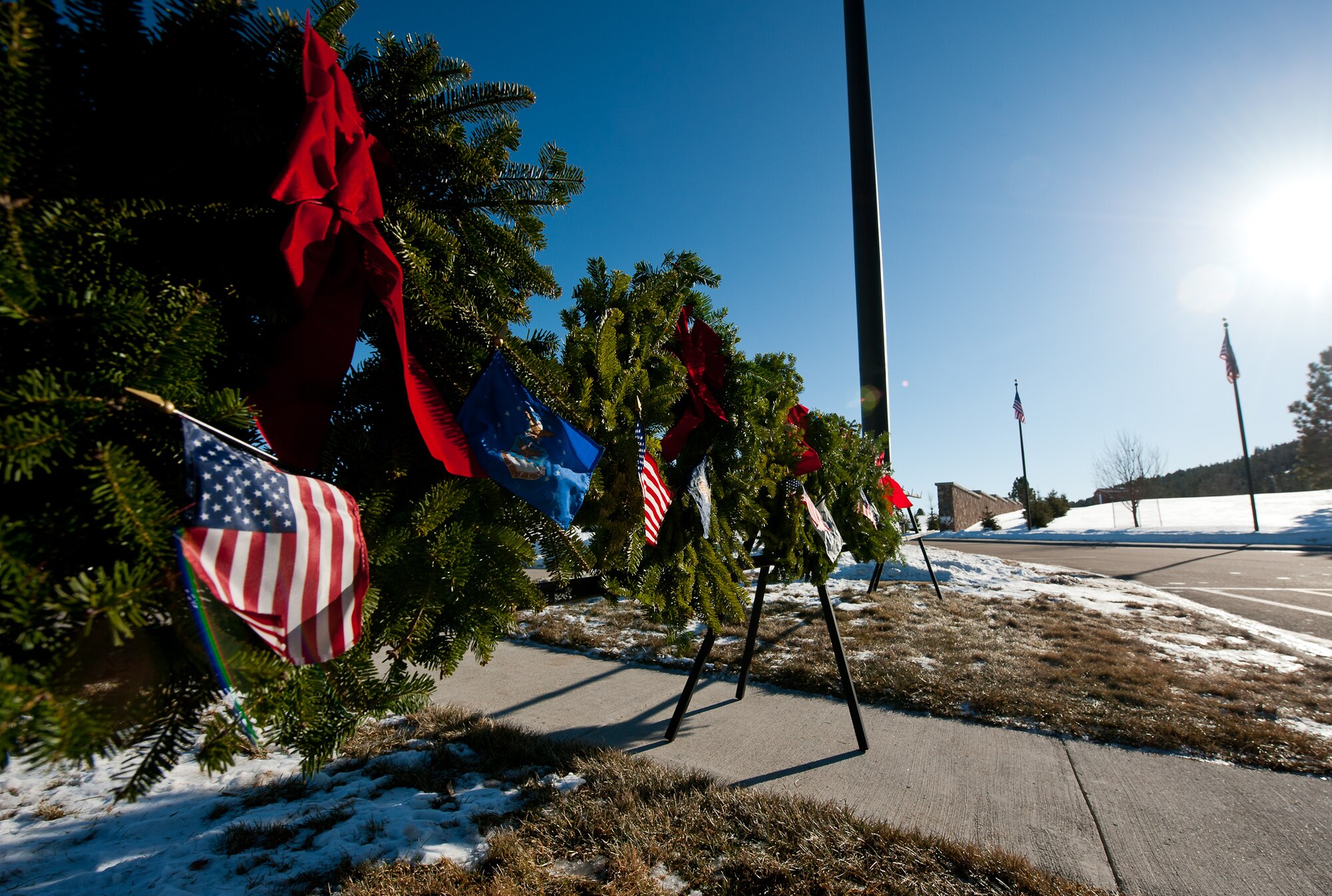 Ceremonial wreaths representing each branch of the United States military and Prisoner of War/Missing in Action were placed during the Wreaths Across America ceremony at the Black Hills National Cemetery near Sturgis, S.D., Dec. 10, 2011. The Knights of Columbus completed the ceremony to honor past and present U.S. military members to pay respect to the armed forces. (U.S. Air Force photo by Airman 1st Class Kate Thornton/Released)