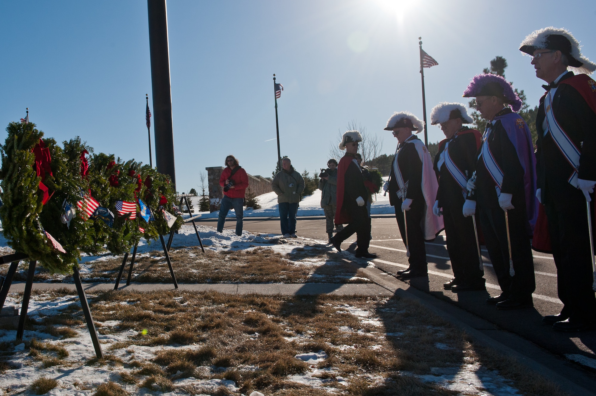 Members of the Knights of Columbus, a national organization dedicated to benefitting society through charitable works, post in front of the Wreaths Across America ceremony at the Black Hills National Cemetery near Sturgis, S.D., Dec. 10, 2011. Wreaths Across America is an annual event that takes place at all U.S. national cemeteries to pay respect to past and present servicemembers and their families. (U.S. Air Force photo by Airman 1st Class Kate Thornton/Released)