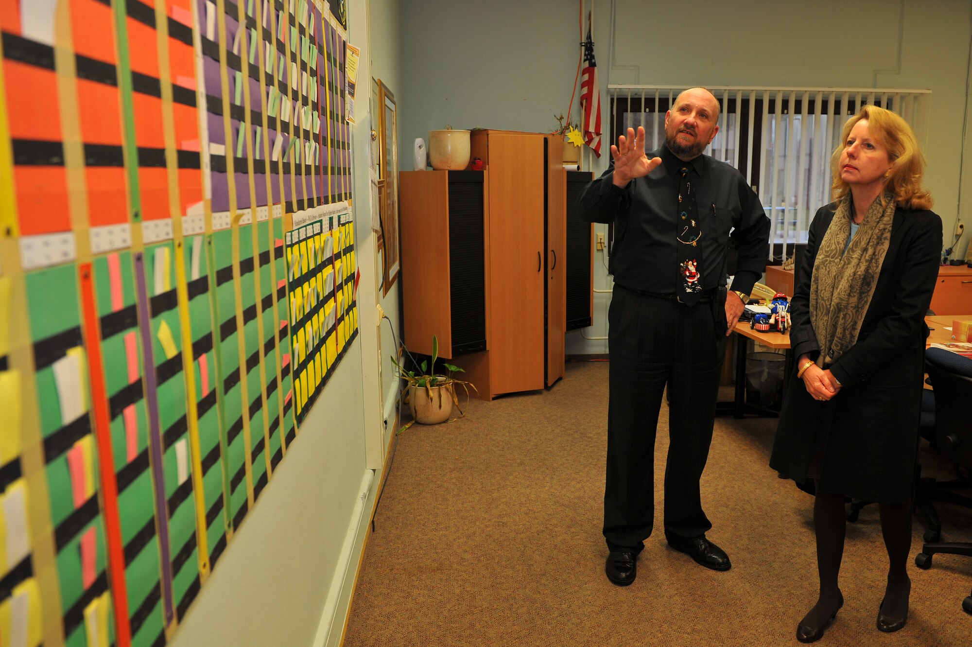 SPANGDAHLEM AIR BASE, Germany – Richard Alix, Spangdahlem Elementary School principal, discusses a data progress wall for students with Laura Stavridis, wife of U.S. Navy Adm. Jim Stavridis, U.S. European Command commander and Supreme Allied Commander Europe, during a familiarization tour here Dec. 14.  The school uses the progress wall to track students’ academic progress throughout the year so teachers can provide more accurate and detailed instruction. (U.S. Air Force photo/Tech. Sgt. Jonathan Pomeroy)
