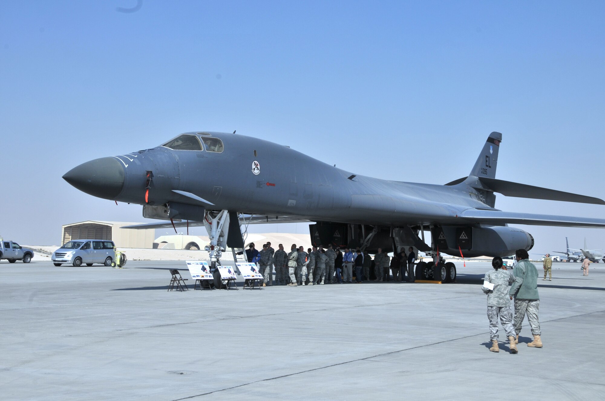 Attendees line up for a tour of the B-1B Lancer during the 2011 Flightline Fest at an undisclosed location in Southwest Asia Dec. 15, 2011. The 379th Air Expeditionary Wing hosts the annual event to offer service members the opportunity to examine first-hand the aircraft that execute the wing's expeditionary mission. Various units from the wing as well as units from coalition partners put on demonstrations and displays to educate people on how they cooperate with each other to accomplish the mission. (U.S. Air Force photo/Senior Airman Michael Charles)