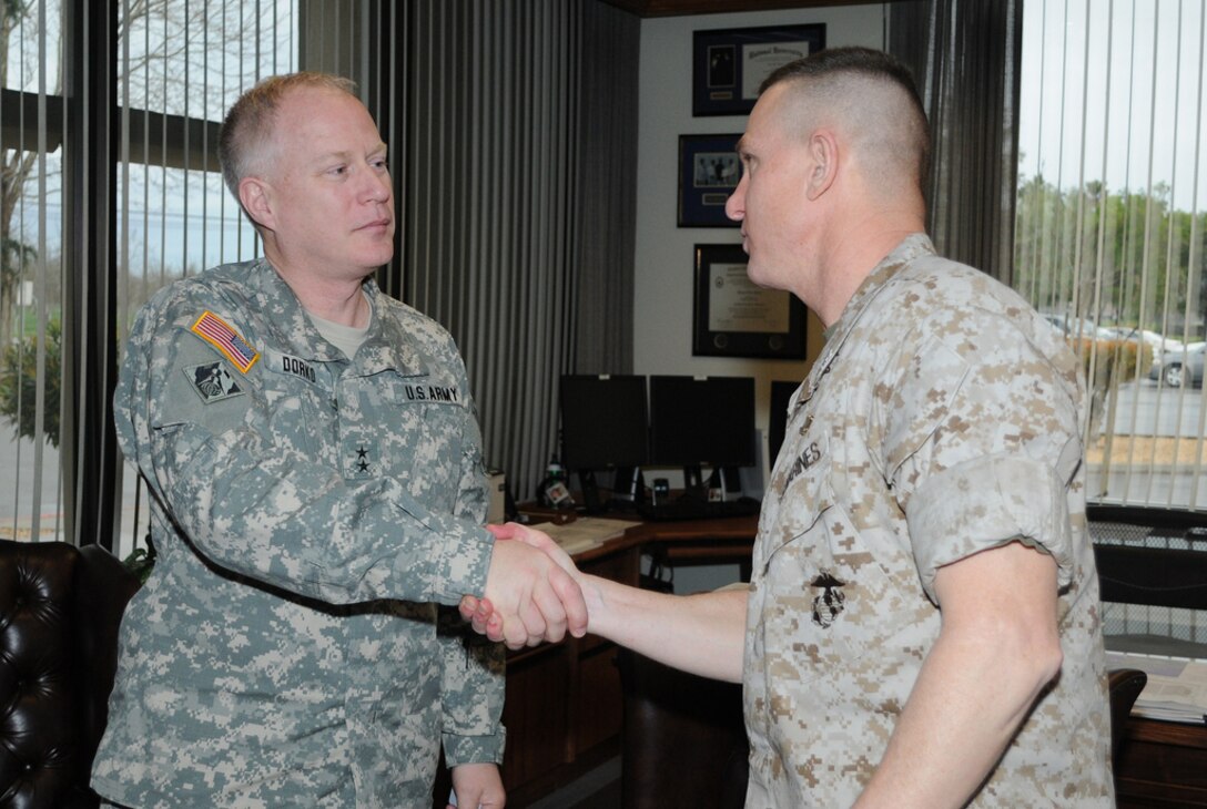 CALIFORNIA — Maj. Gen. Jeffrey J. Dorko, the Deputy Commanding General for Military and International Operations for the U.S. Army Corps of Engineers, greets Marine Col. Adrian W. Burke, commander of the Defense Logistics Agency Distribution San Joaquin, during a recent trip to Tracy Army Depot March 23, 2011. (U.S. Army Corps of Engineers photo)