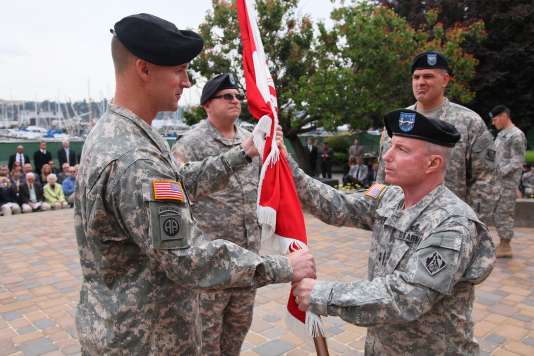 SAUSALITO, Calif. — Maj. Gen. Bo Temple (right), deputy commanding general of the U.S. Army Corps of Engineers, passes the guidon to Col. Mike Wehr, incoming commander of the Corps' South Pacific Division, in a change of command ceremony at the Corps' Bay Model visitor center here, June 3, 2011. (U.S. Army Corps of Engineers photo by Michael J. Nevins)