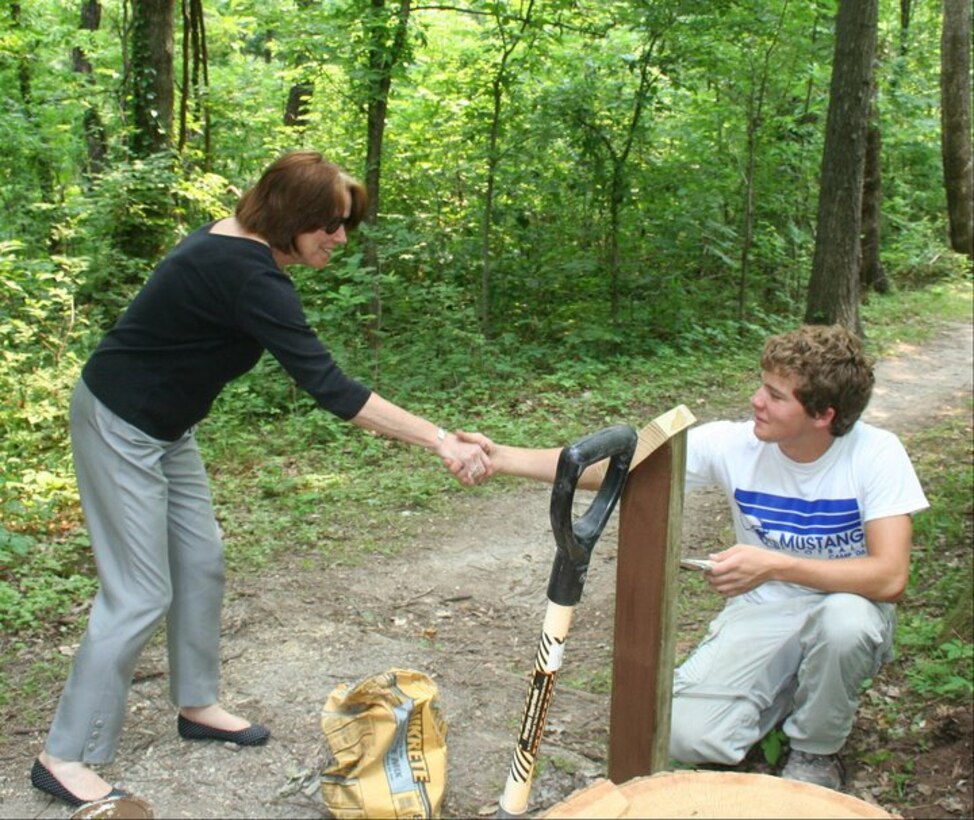 OOLOGAH — Ms. Jo-Ellen Darcy, Assistant Secretary of the Army for Civil Works, shakes hands with a boy scout during her visit to Oologah Lake to promote the President's America's Great Outdoors Initiative. Darcy visited the Tulsa District June 8-9. During her visit, she spoke with employees, visited Oologah Lake, and visited the Webbers Falls Powerhouse. (U.S. Army Corps of Engineers photo)