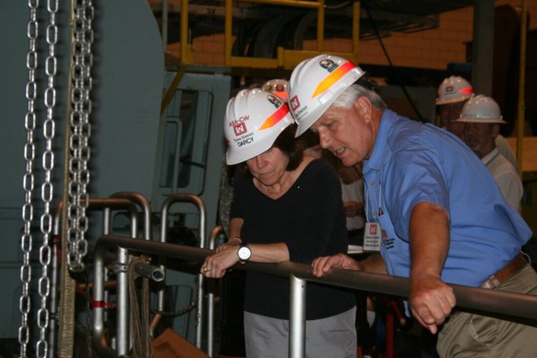 WEBBERS FALLS — Howard Davidson, powerplant specialist at Webbers Falls, explains the Webbers Falls powerhouse rehabilitation project . Jo-Ellen Darcy, Assistant Secretary of the Army for Civil Works during her visit to Tulsa District. (U.S. Army Corps of Engineers photo)