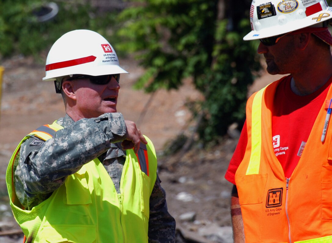 JOPLIN, Mo. -- Maj. Gen. Merdith W. B. "Bo" Temple, acting chief of engineers and acting commanding general of USACE, discusses debris removal operations with Louis Audi, a quality assurance representative, during a visit here July 19. Since June 2, Corps employees have supervised the removal of more than 1.2 million cubic yards of tornado debris from Joplin streets and private properties. Audi, is a deployed employee from the Corps' Walla Walla District in Washington. More than 300 Corps employees have volunteered to serve in support of federal recovery operations here. (U.S. Army photo/Mark Haviland)