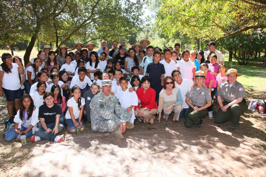 Students from Maple Elementary School take a break for a photo with Assistant Secretary of the Army for Civil Works, Jo-Ellen Darcy (front row, second from right), U.S. Rep. Doris Matsui (to Darcy’s right) and U.S. Army Corps of Engineers leaders and park rangers at the Effie Yeaw Nature Center in Carmichael, Calif., Sept. 27. Corps park rangers led the students on nature walks and outdoor education activities in support of President Barack Obama’s America’s Great Outdoors Initiative, established in April 2010, to reconnect the American people with the outdoors. "Today was all about connecting kids with nature,” said Col. Bill Leady, commander of the U.S. Army Corps of Engineers Sacramento District (front row, left), which hosted the event. ”Being outdoors is so important; not just for our health, but for understanding the natural world that we belong to. We all have a responsibility to help protect it, and as the nation's environmental engineers, it's important for us to share that message," he said.