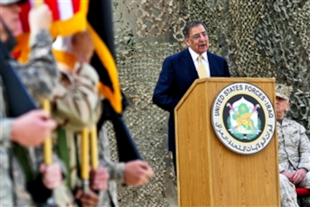 Secretary of Defense Leon E. Panetta talks to U.S. service members at the former Sather Air Base in Baghdad during a ceremony that marked the end of Operation New Dawn on Dec. 15, 2011.  Since 2003 more than 1 million have served in Iraq.  Commander of U.S. and International Forces in Afghanistan Gen. John R. Allen (right), U.S. Marine Corps , also participated in the ceremony.  