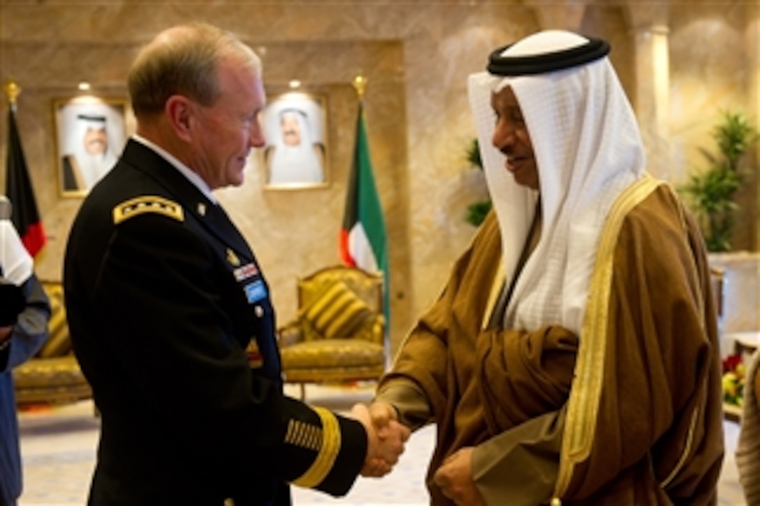 Kuwaiti Prime Minister Sheikh Jaber Mubarak Al-Sabah greets Chairman of the Joint Chiefs of Staff Gen. Martin E. Dempsey for a meeting in Kuwait City, Kuwait, on Dec. 14, 2011.  