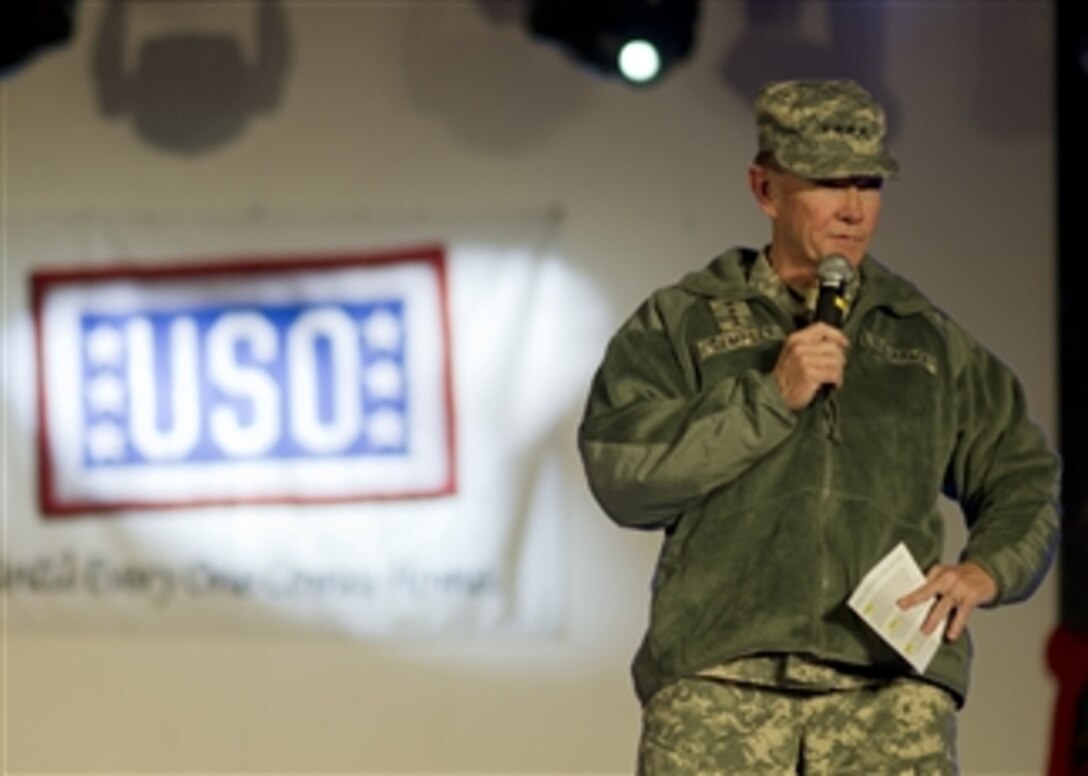 Chairman of the Joint Chiefs of Staff Gen. Martin E. Dempsey addresses the audience of the USO show at Camp Buehring, Kuwait, on Dec. 14, 2011.  