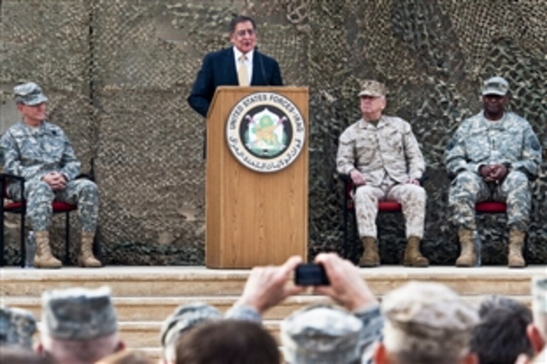 U.S. Defense Secretary Leon E. Panetta speaks at the ceremony to mark the end of the U.S. mission in Iraq in Baghdad, Dec. 15, 2011. U.S. Gen. Martin E. Dempsey, left, chairman of the Joint Chiefs of Staff, U.S. Marine Corps Gen. John R. Allen, commander of U.S. and international forces in Afghanistan, and U.S. Army Gen. Lloyd J. Austin III, commander of U.S. Forces Iraq, listened to Panetta's remarks.