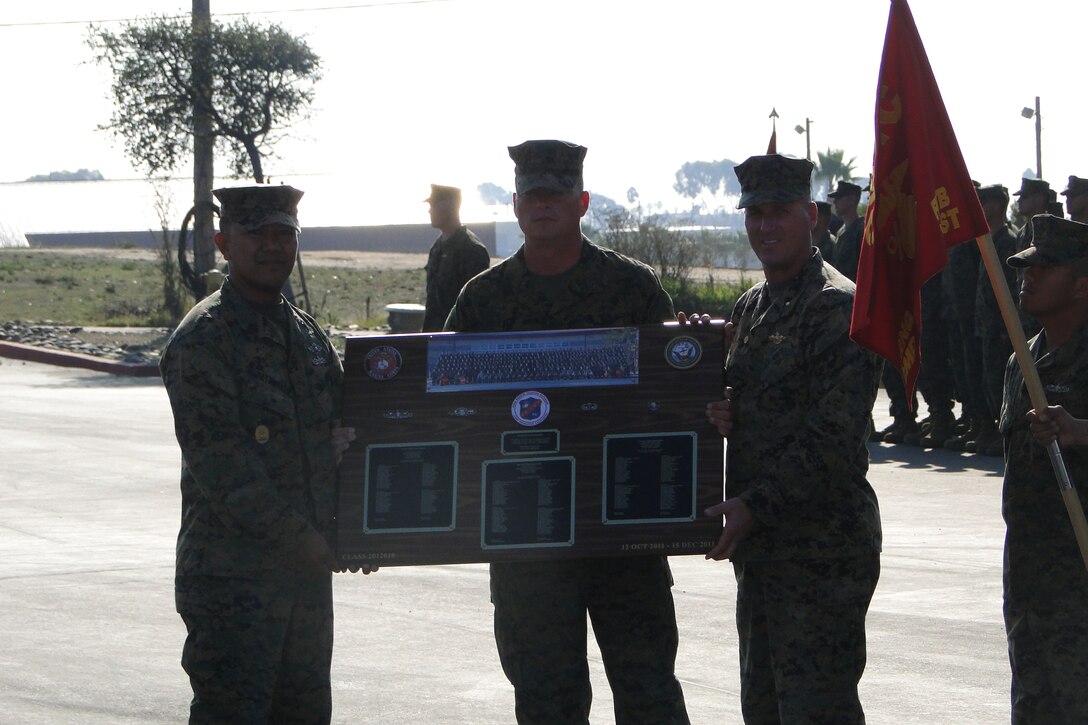 Class 2012010 Company First Sergeant presented the Class Plaque to Command Master Chief Patawaran and Commanding Officer Capt Eby during the Graduation Ceremony on December 15, 2011.