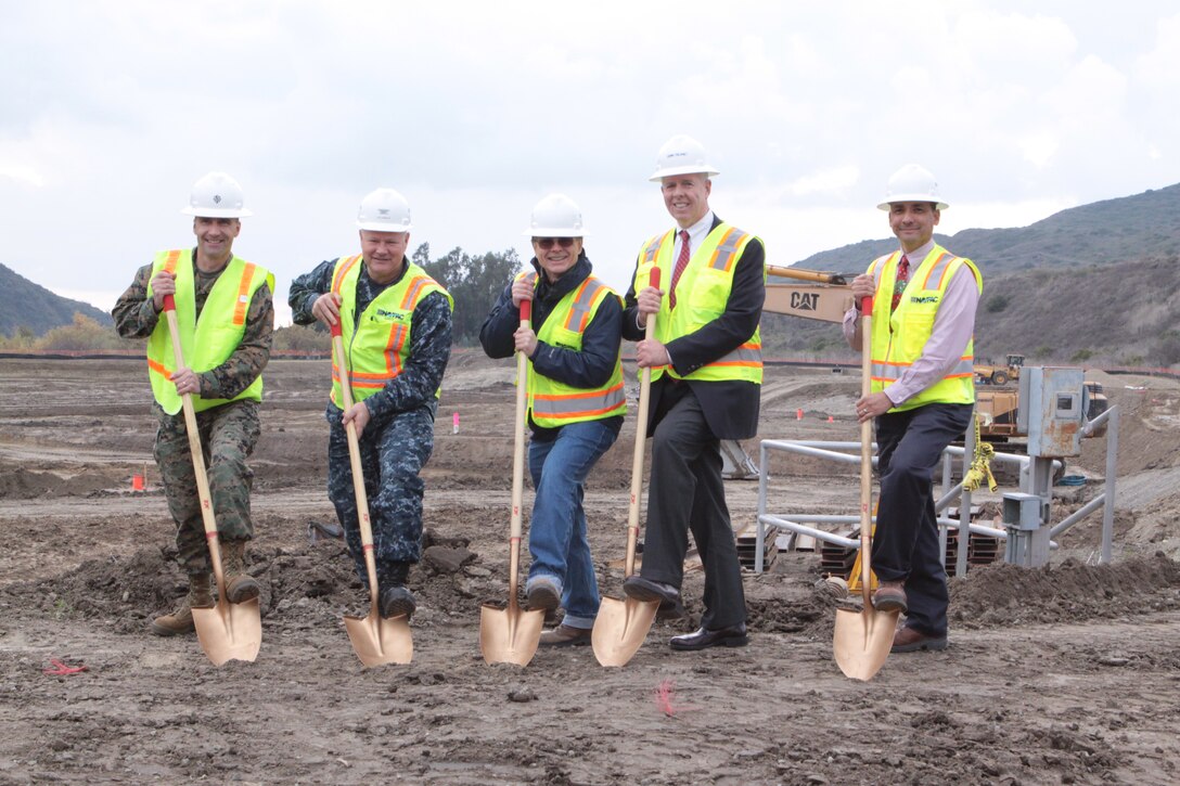 left to right) Lt. Col. Todd Kerzie, facilities maintenance officer for MCB Camp Pendleton; Navy Capt. Mike Williamson, commanding officer and officer in charge of construction for Marine Corps Installations West; Mike White, construction manager with the resident officer in charge of construction; Mike Malloy, President of Camp Dresser and McKee, Inc., and Joe Riojas, supervisory general engineer from ROICC, prepare to shovel dirt at the groundbreaking ceremony, Dec. 15 for the P-1043 Northern Region Tertiary Treatment Plant, which recently began construction. The new plant, which will cost $112,330,000, will include more than 6.5 miles of piping and process more than five million gallons of water per day. Construction is scheduled for completion on Oct. 12, 2013.