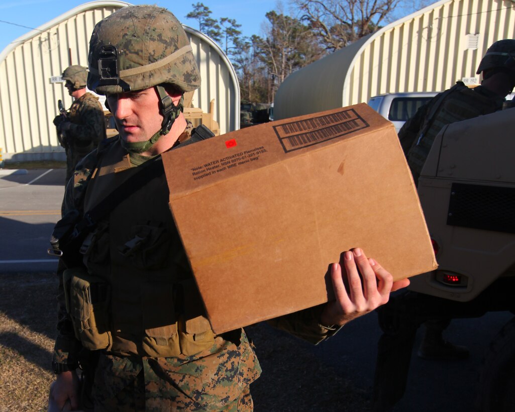 Marines with the 24th Marine Expeditionary Unit carry in supplies to a notional American Embassy during a training scenario as part of the Composite Training Unit Exercise (COMPTUEX), Dec. 15. The scenario has the Marines preparing for a non-combatant evacuation operation, called NEO for short, to evacuate American citizens and other authorized personnel from a country in turmoil. The 24th MEU is currently taking part in COMPTUEX, scheduled to take place Nov. 28 to Dec. 21. The training is meant to develop cohesion between the 24th MEU and Amphibious Squadron 8 in conducting amphibious operations, crisis response and limited contingency operations while operating from the sea.