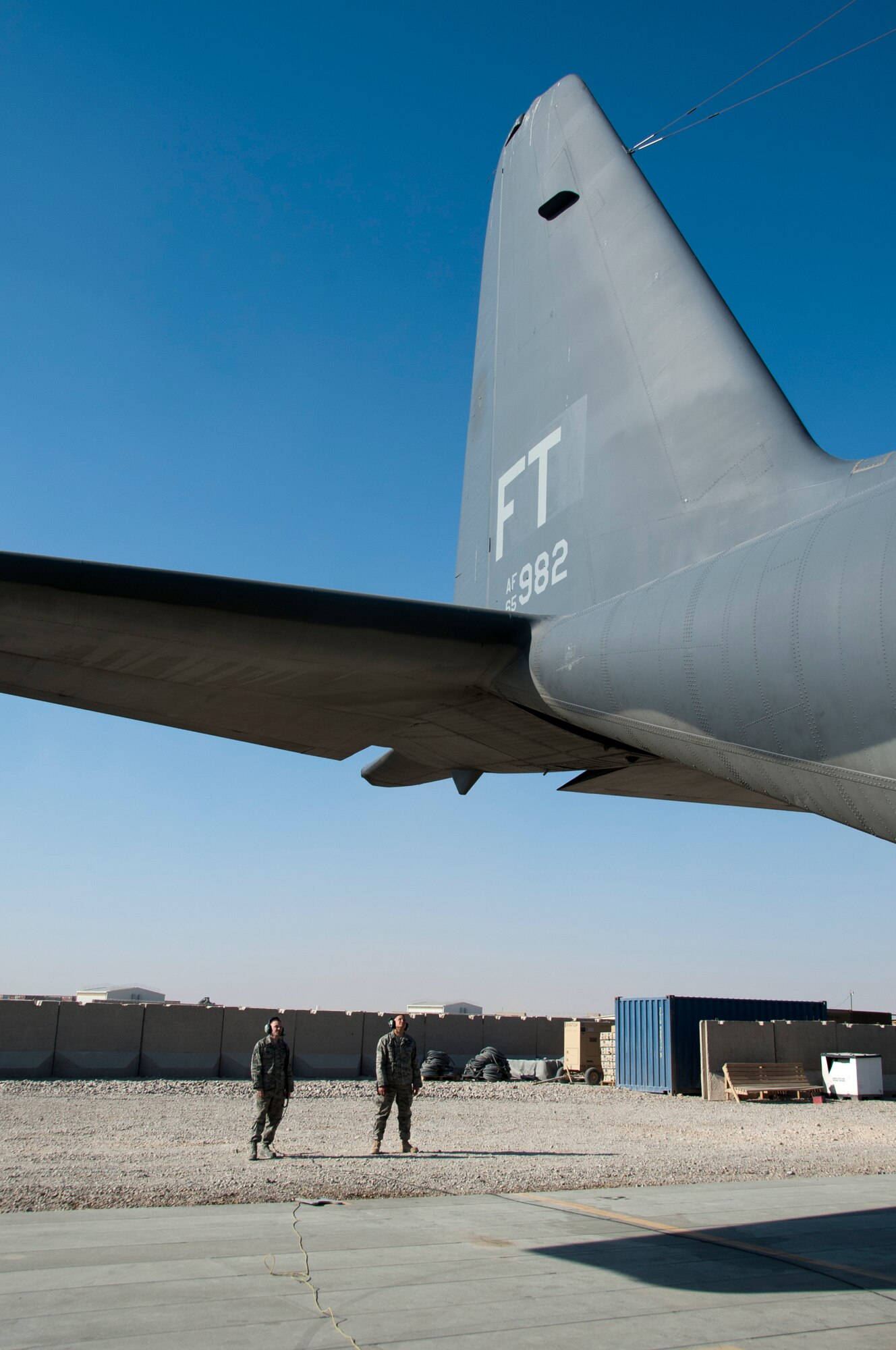 CAMP BASTION, Afghanistan -- Maintenance Airmen assigned to the 76th Expeditionary Rescue Squadron perform preflight checks on a HC-130P Combat King at Camp Bastion, Afghanistan, Dec. 14, 2011. The Airmen are deployed from Moody Air Force Base, Ga. (U.S. Air Force photo by Staff Sgt. David Carbajal)