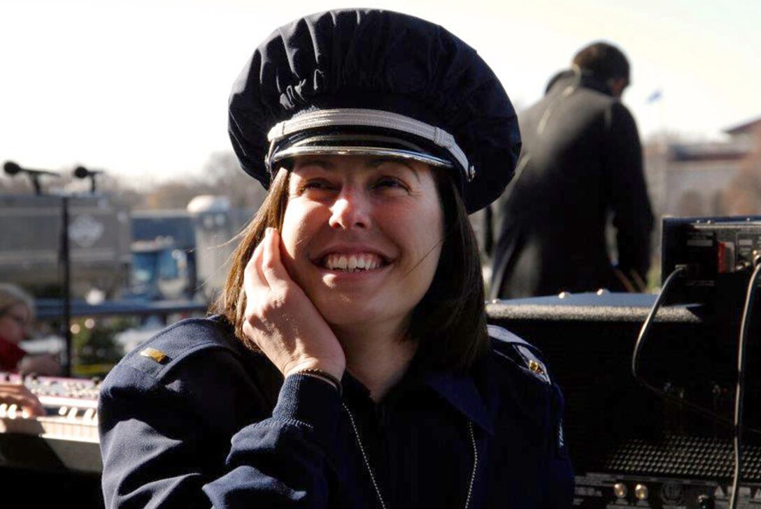 2nd Lt. Shanti Nolan, U.S. Air Force Band officer in charge of outreach, waits excitedly Dec. 1 for the National Tree Lighting Ceremony, Washington, D.C., to begin. Nolan conducted the Airmen of Note, the USAF premier jazz ensemble, as they played holiday arrangements for the Commander in Chief, thousands of spirited holiday viewers and distinguished ceremony guests such as Rodney Atkins, Carson Daly, One Republic, Santa Claus and the famed Kermit The Frog. (Photo compliments of the Airmen of Note)