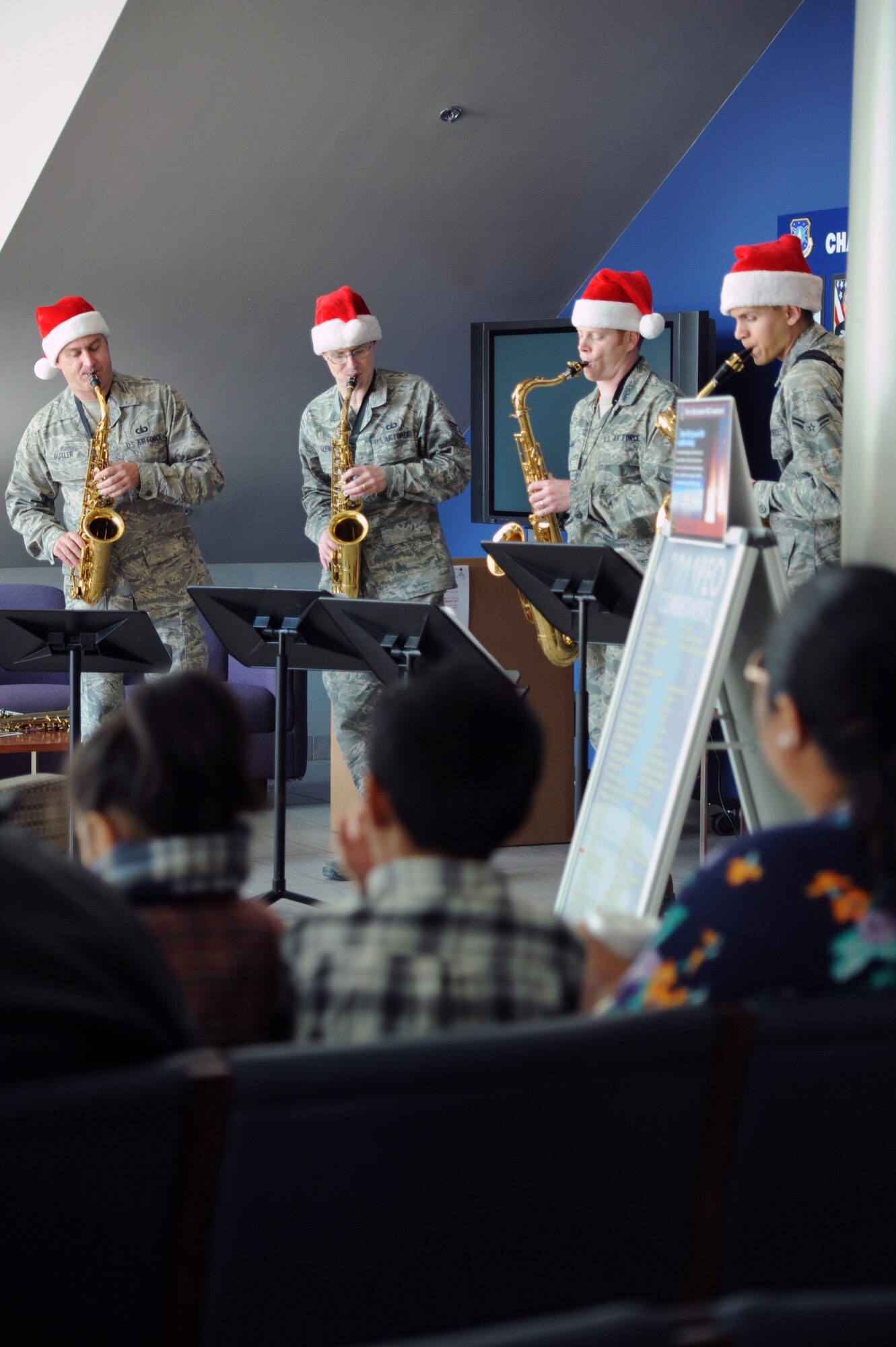 Saxophone players from the U.S. Air Force Band of the Golden West, based at Travis Air Force Base, Calif., entertain members of the US Air Force Space and Missile Systems Center, El Segundo, Calif., Dec. 9, 2011.