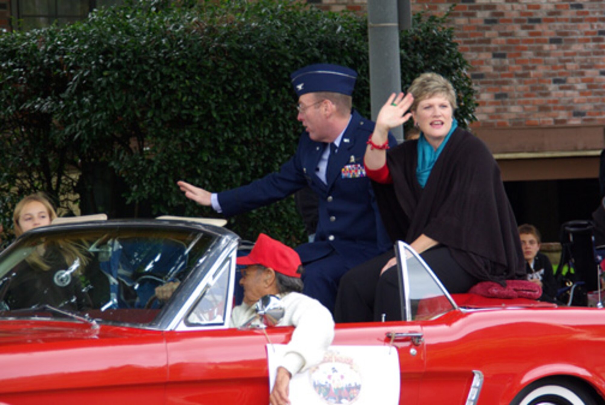 61st Air Base Group Commander, Col. Frank Simcox and his wife wave to the crowds during the El Segundo Holiday Parade, Dec. 11. Celebrating “100 years of holidays,” this year’s parade was the city’s 48th annual. (Photo by Alicia Garges)