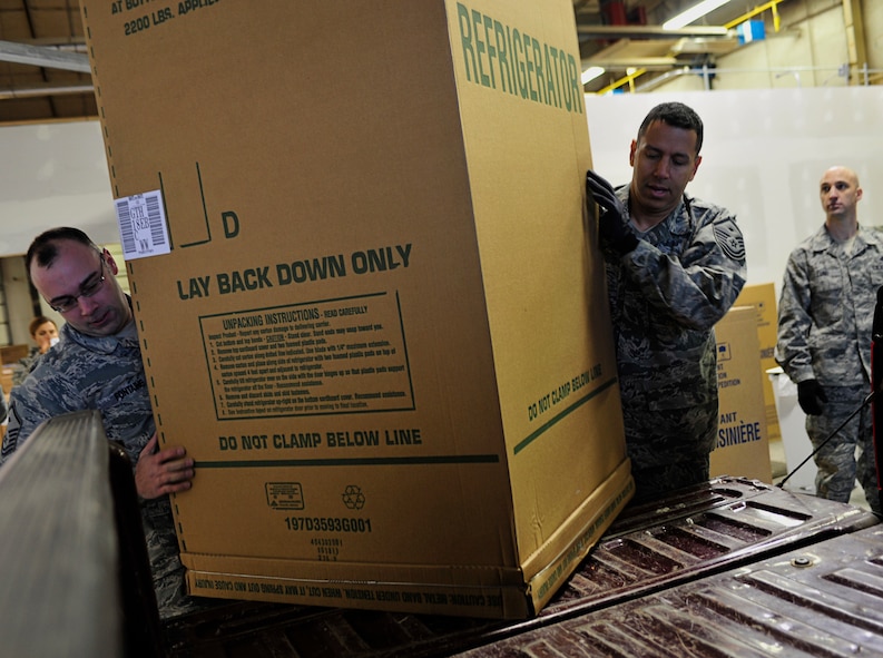 MINOT AIR FORCE BASE, N.D. – Master Sgt. Simon Fontaine, 791st Missile Security Forces Squadron and Master Sgt. Christopher Owen, 91st Operations Group, both first sergeants for their respective squadrons, load a refrigerator for a family in need during Operation Homefront here Dec. 15. Operation Homefront was a charitable initiative headed by the Home Depot Foundation, in coordination with Minot AFB’s Operation Warm Heart and General Electric, which donated more than 130 appliances to Team Minot Airmen and their families affected by the historic Souris River flood. (U.S. Air Force photo/Senior Airman Desiree Esposito)